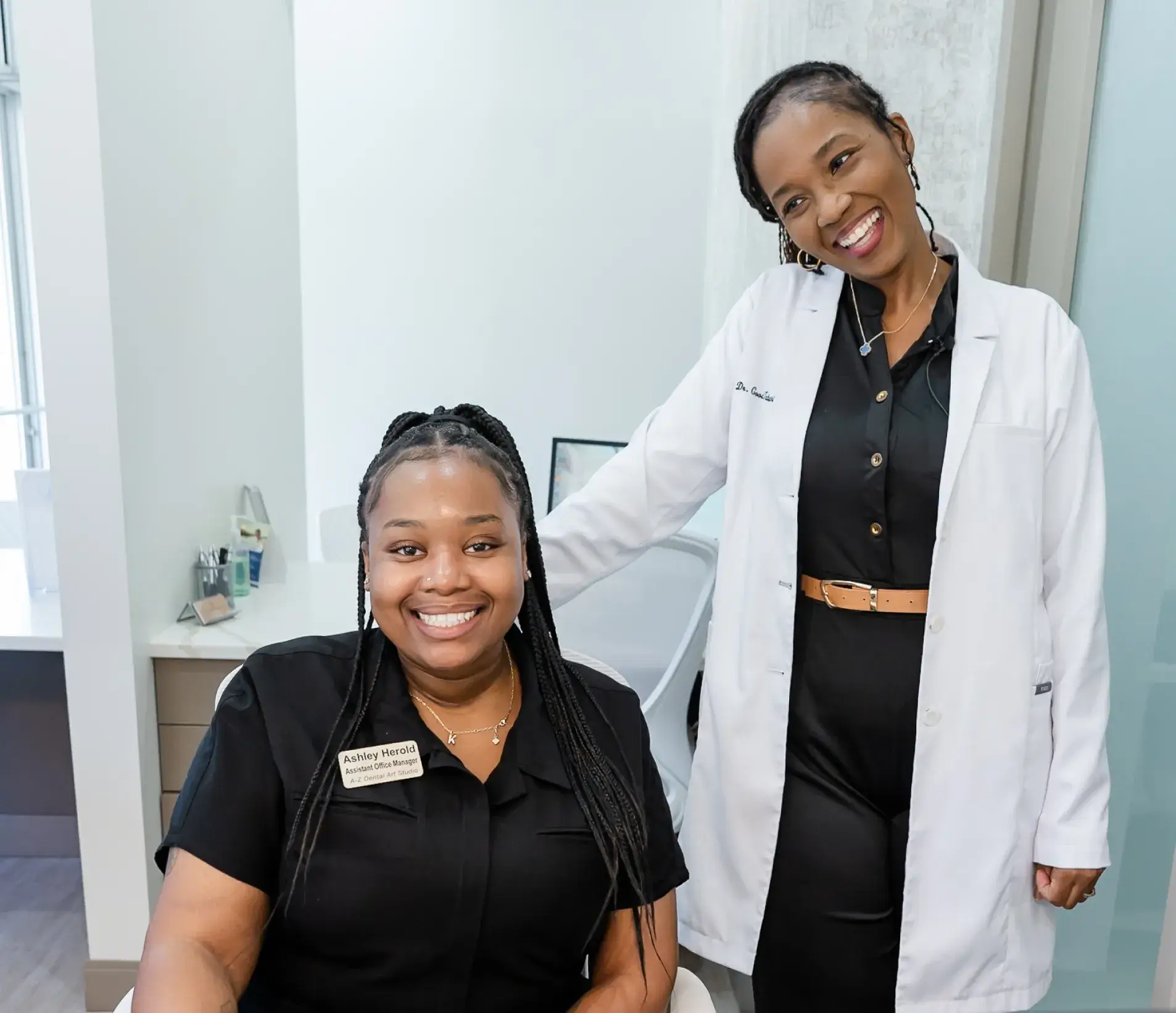 Dr. Ashlee Goodman-Tabari at Dental Art Studio with a team member.
