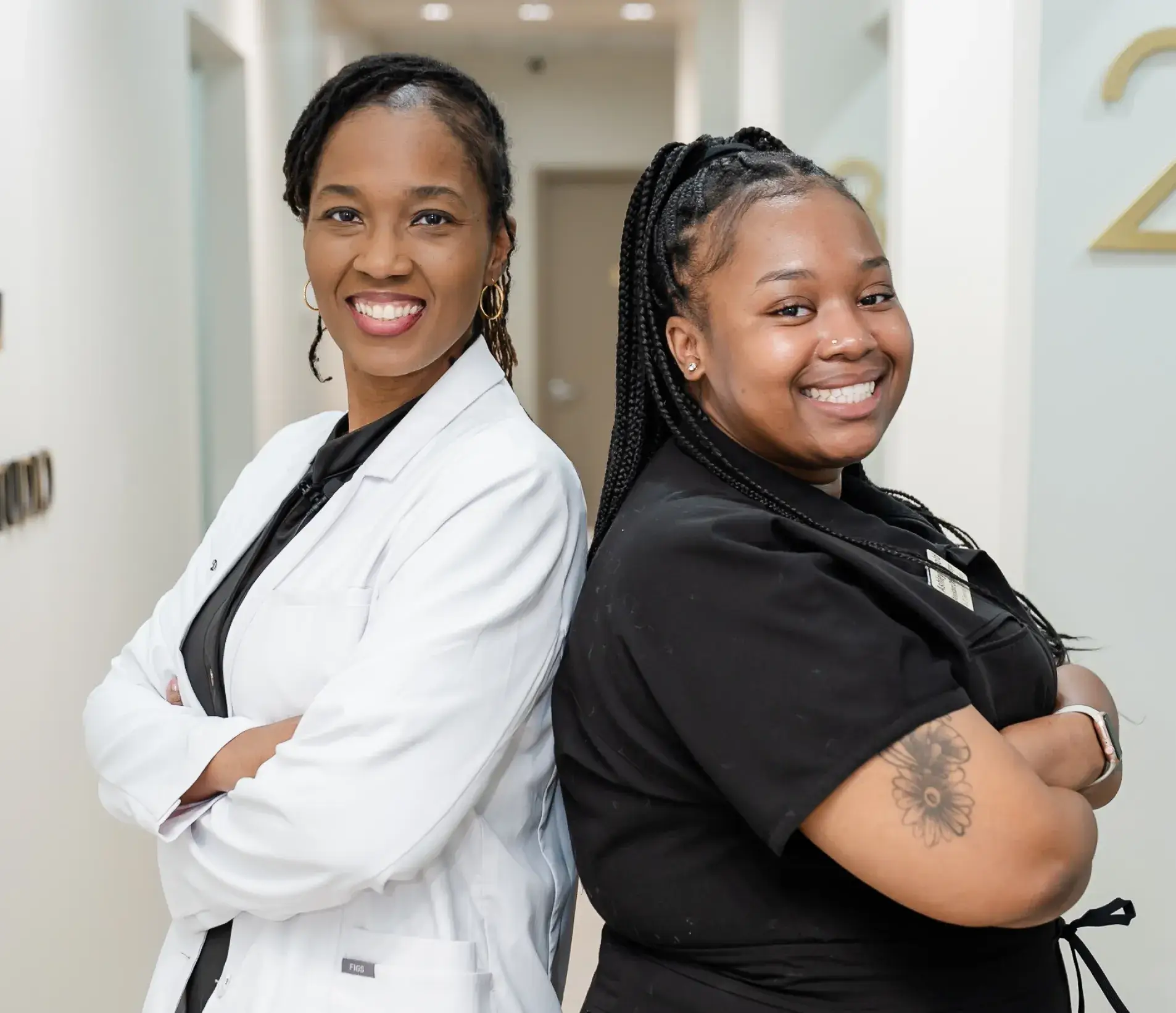 Dr. Ashlee Goodman-Tabari at Dental Art Studio with a team member.