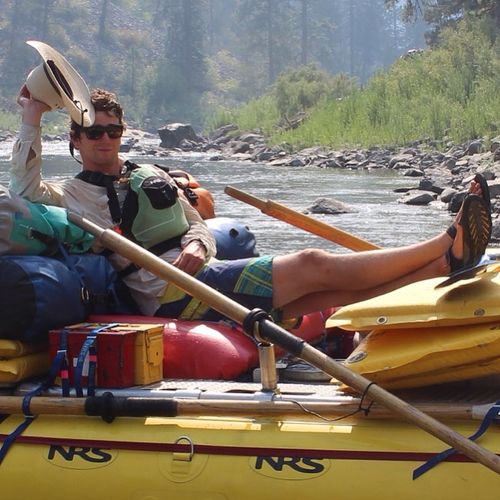 Lounging on a river raft.