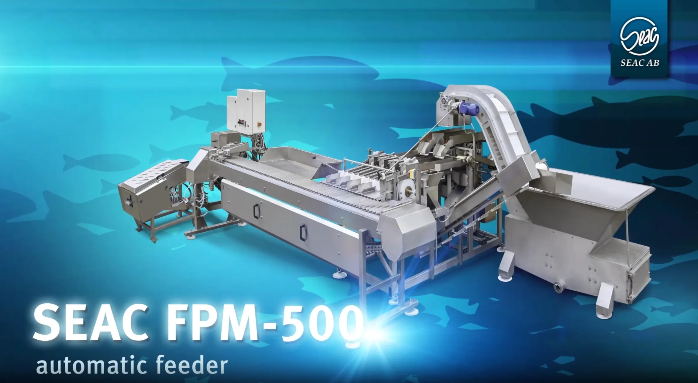 SEAC FPM-500 automatic feeder machine with a conveyor belt and metal components on a blue background with fish silhouettes.