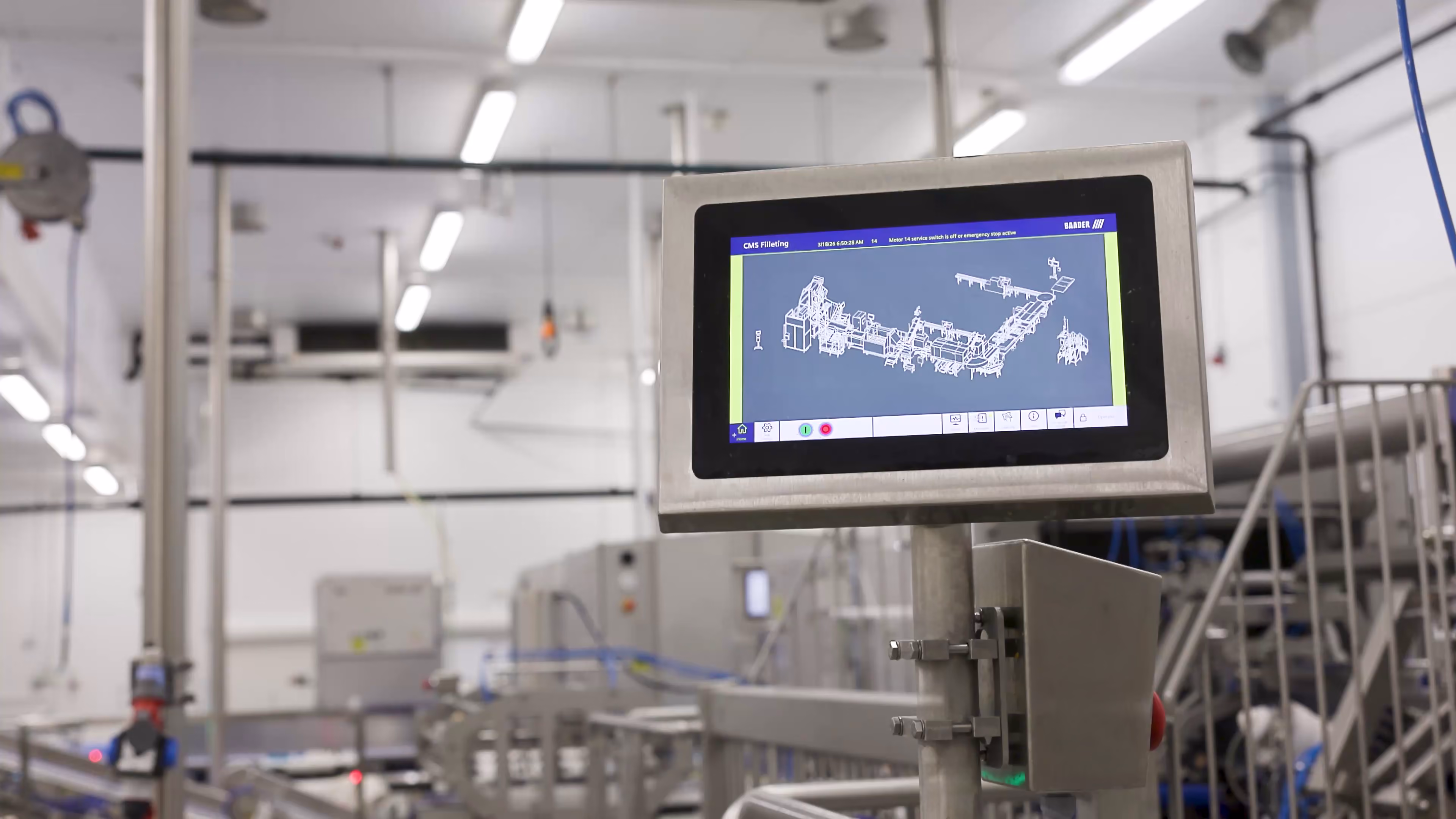 Control panel screen showing a schematic of a packaging line in a factory setting.