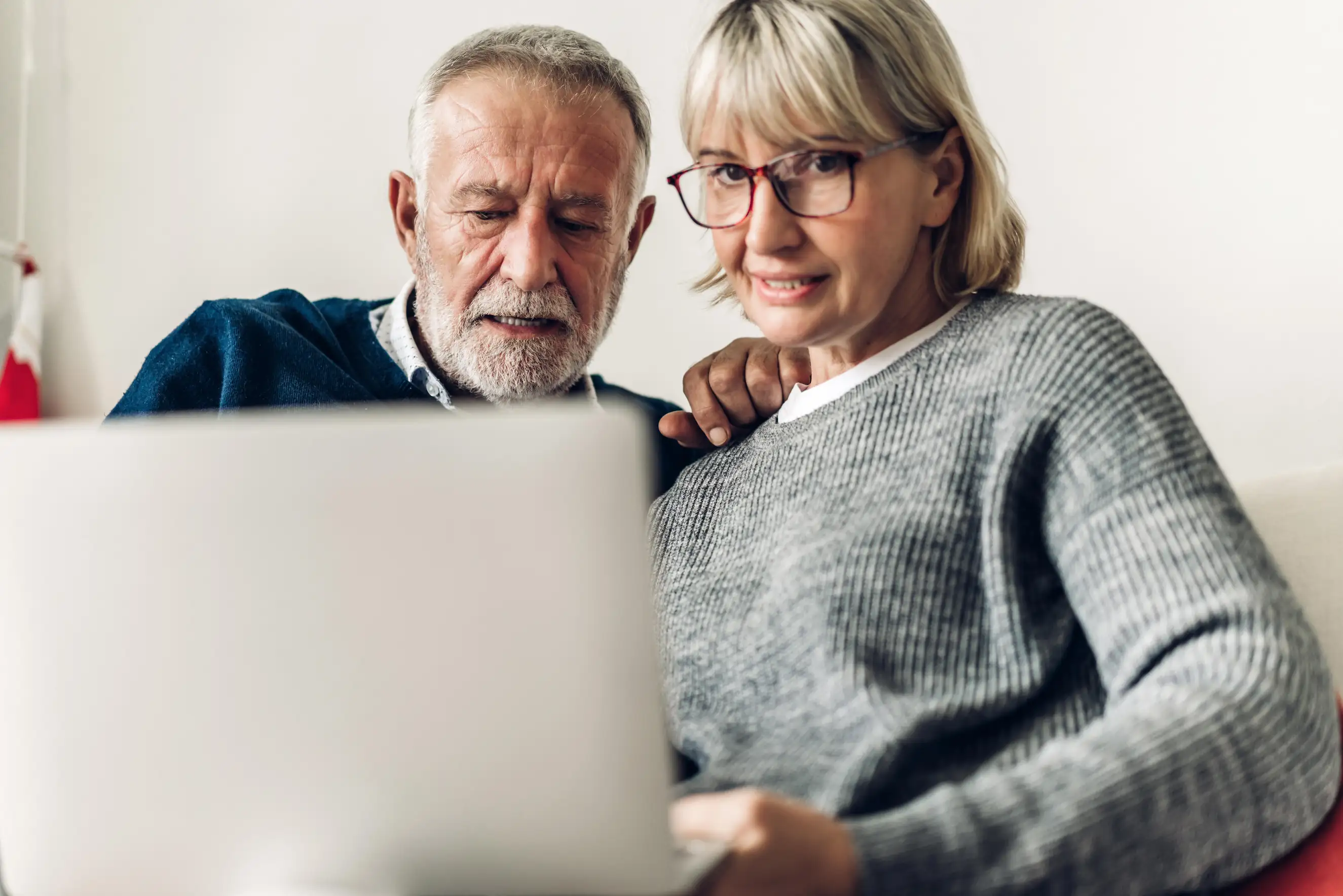 A patient and their care partner submit their PROMs on Force Therapeutics through their laptop at home