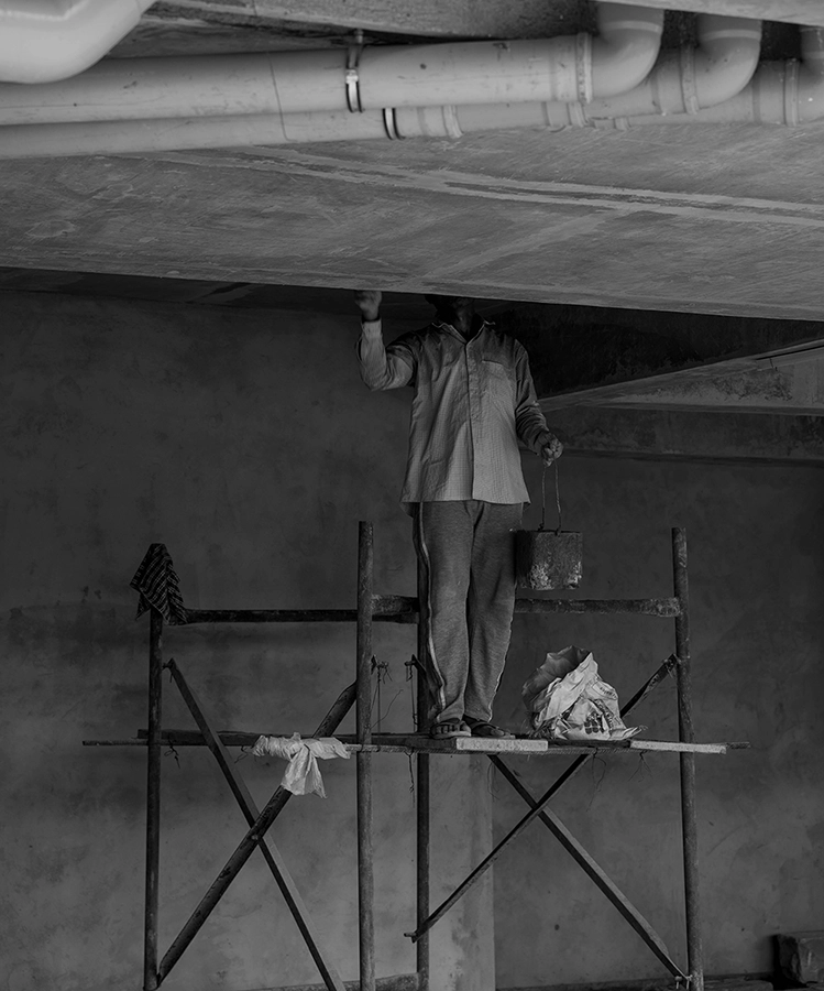 A person painting the wall