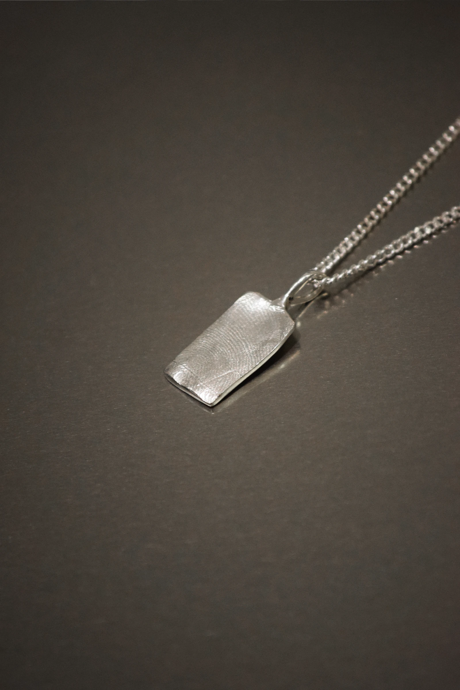 Delta Tag Charm · Silver