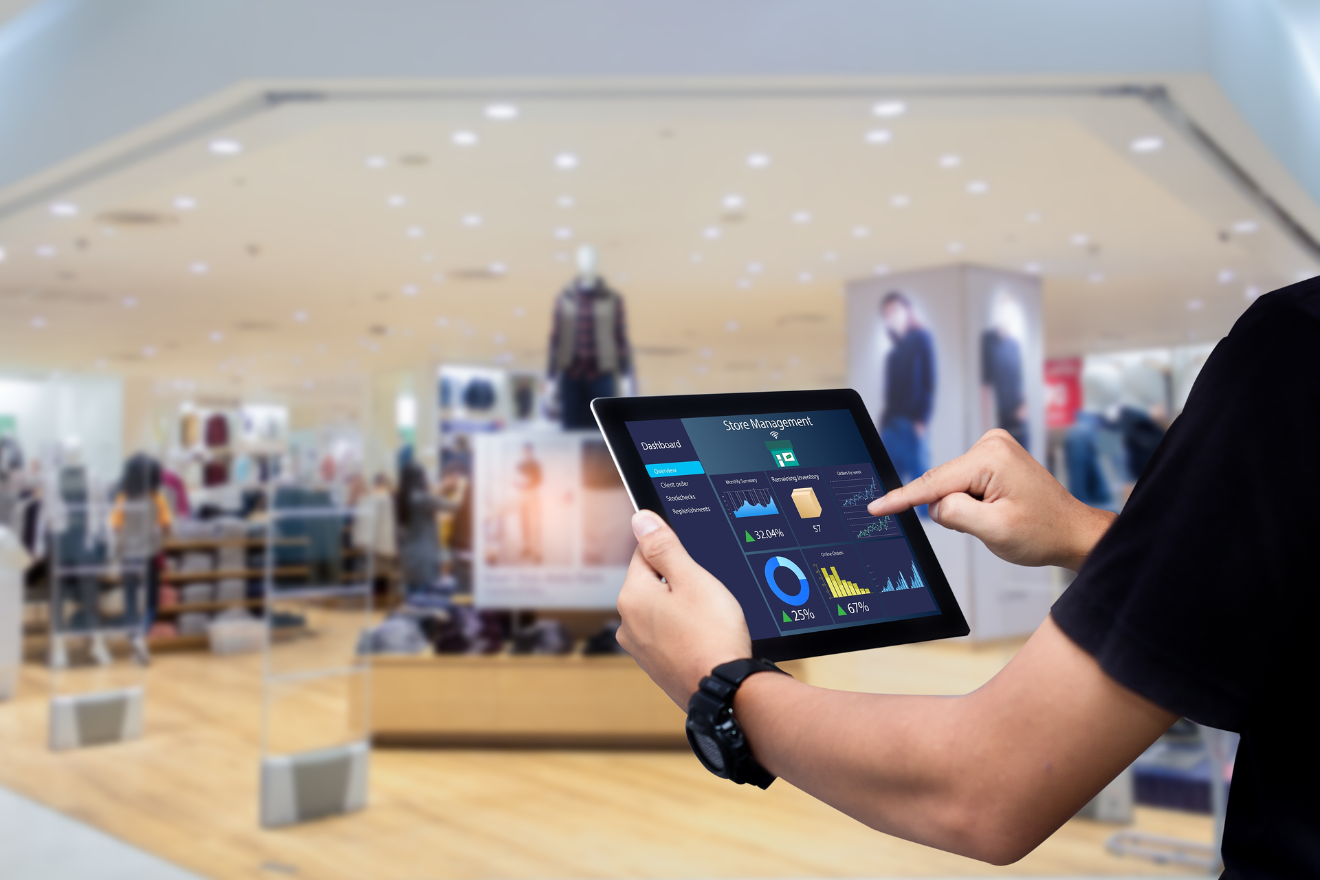 Smart store management systems concept.Manager using digital tablet on blurred store as background