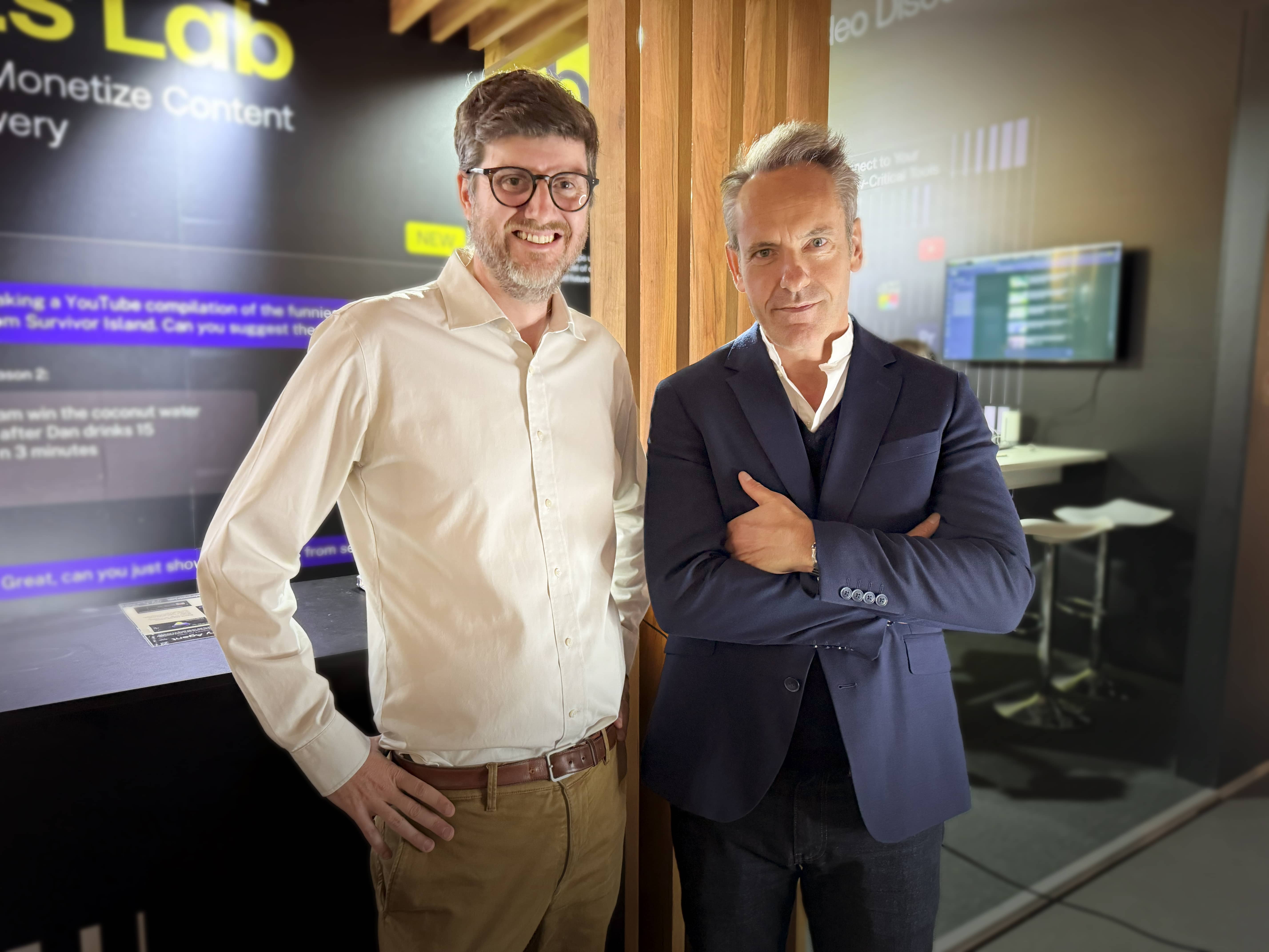 Moments Lab CEO and co-founder Philippe Petitpont smiling and looking at the camera, standing next to Banijay Entertainment Chief Digital and Innovation Officer, Damien Viel in front of the Moments Lab stand at IBC2025.