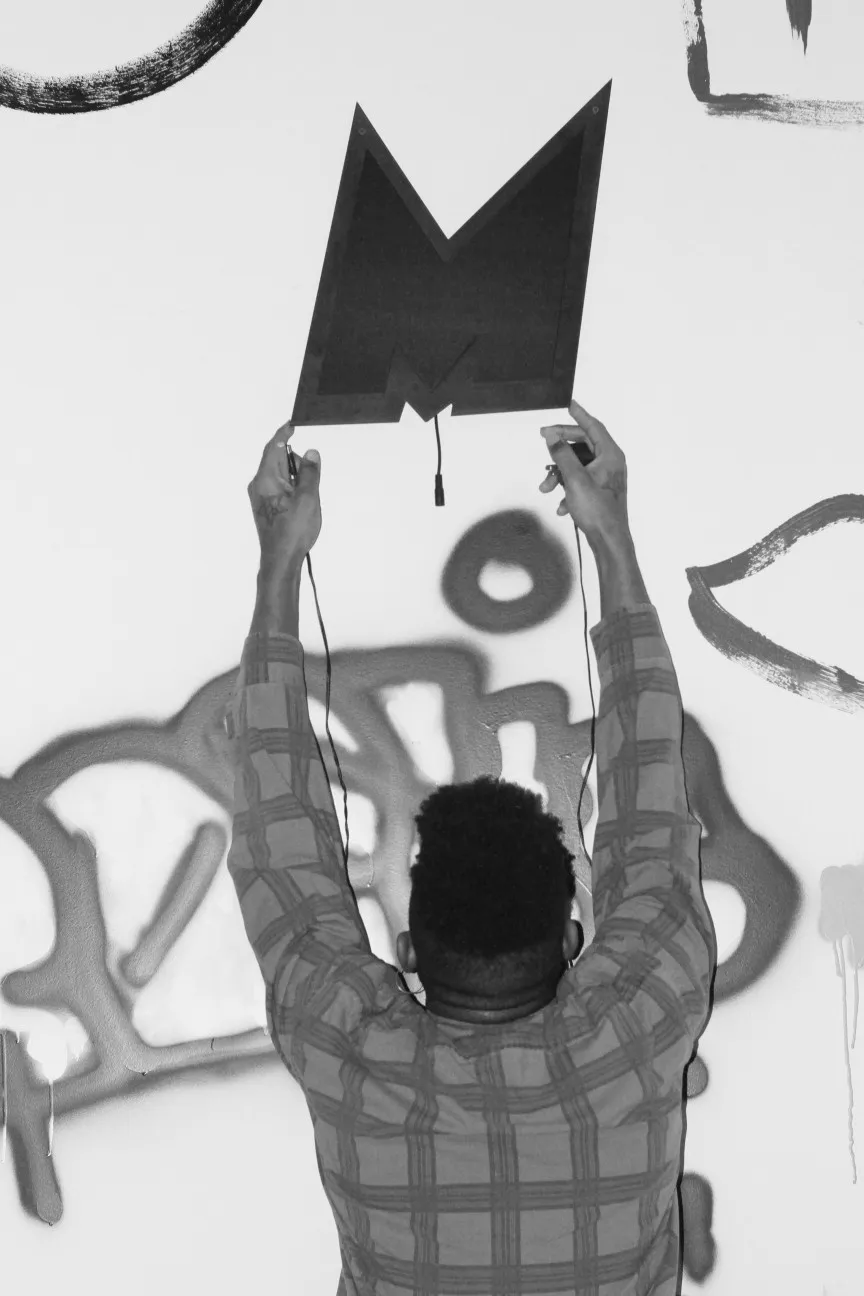 Black and white photo installing electronic art sculpture