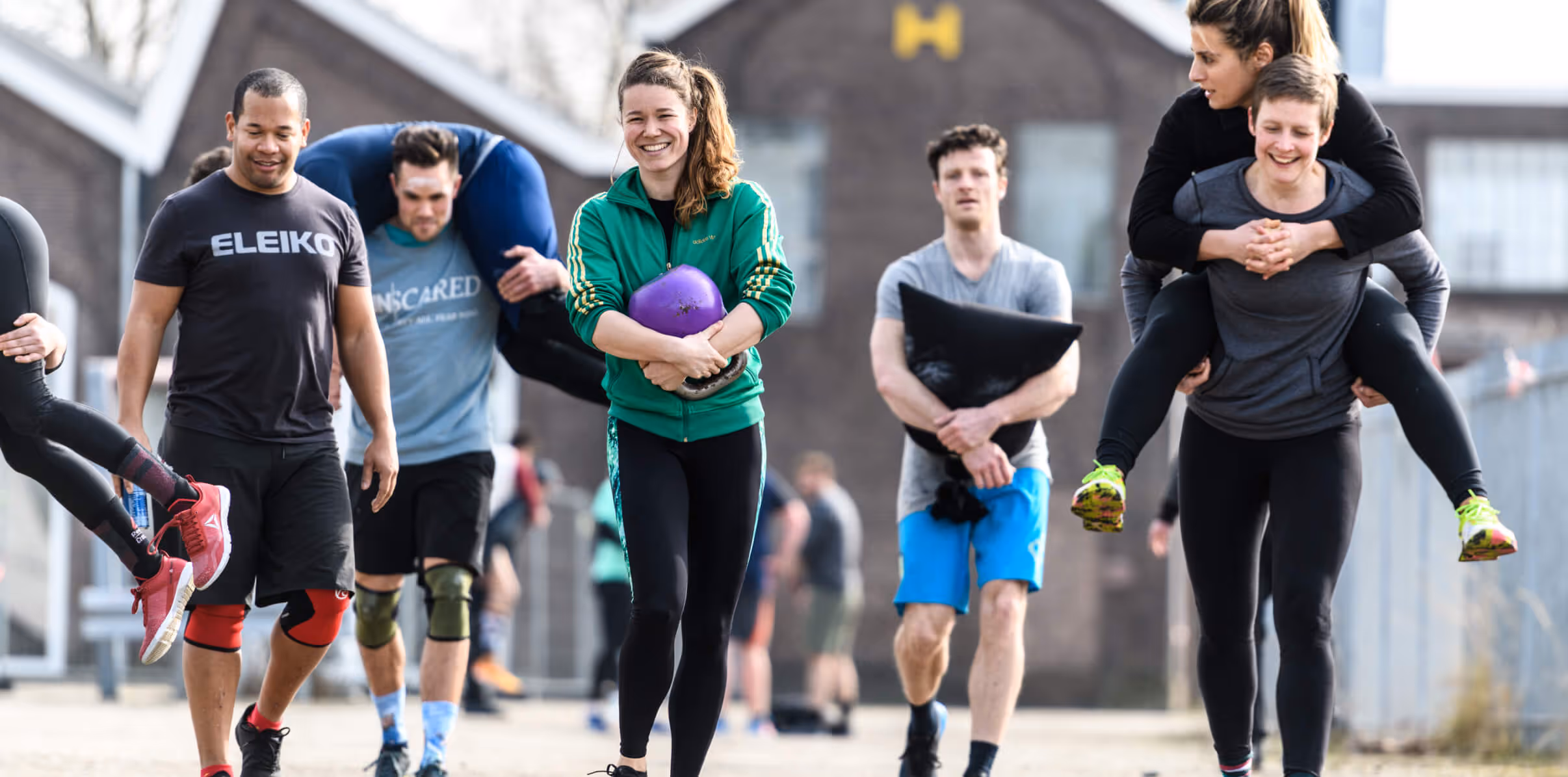 A Crossfit group of laughing people at UnScared