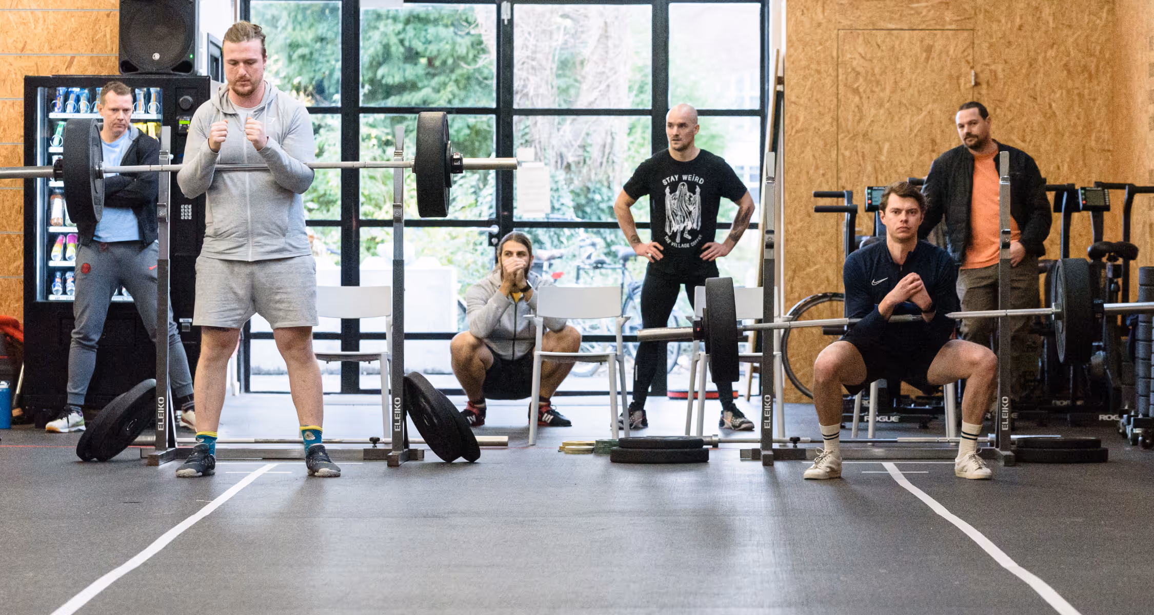 Athlete putting on weights on the bar