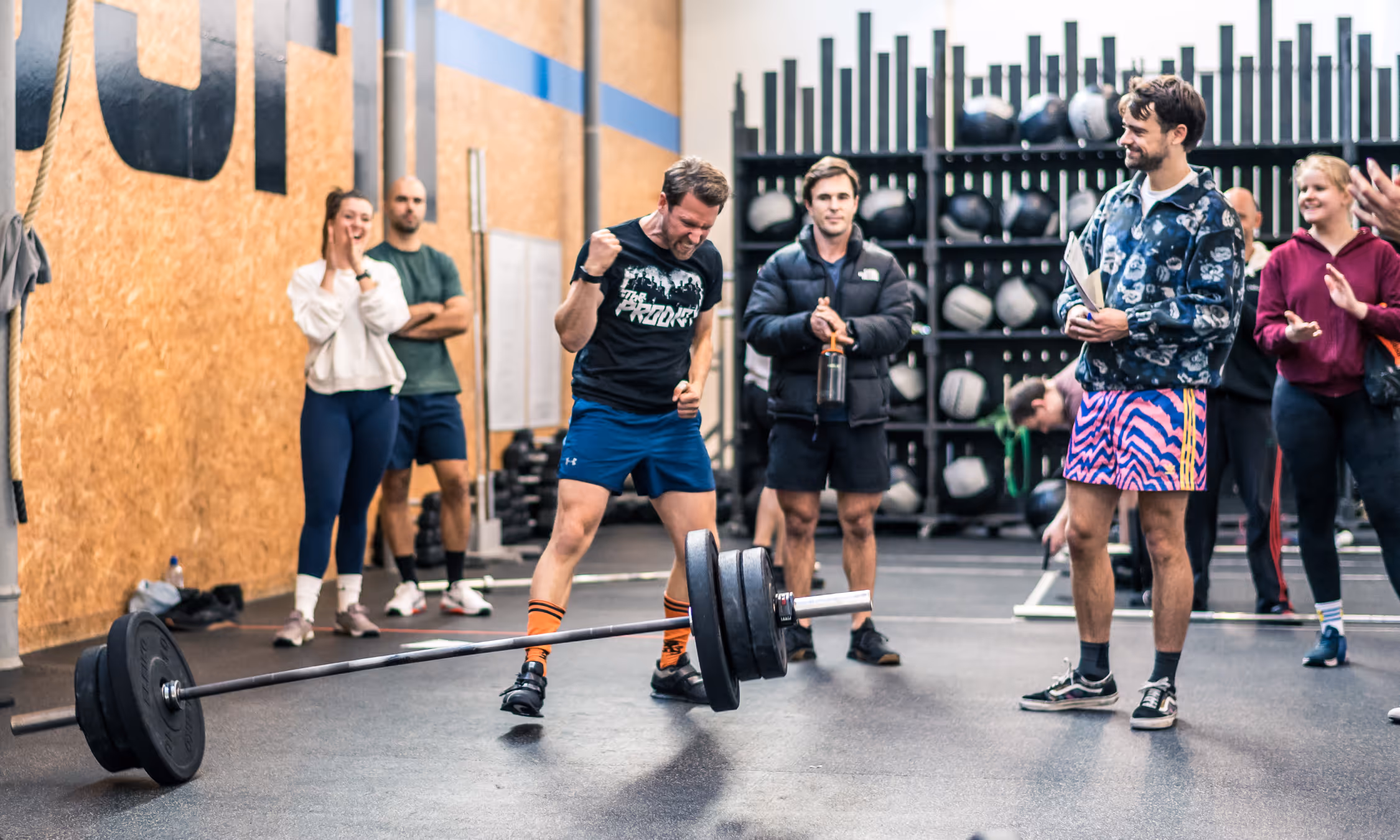Athlete putting on weights on the bar