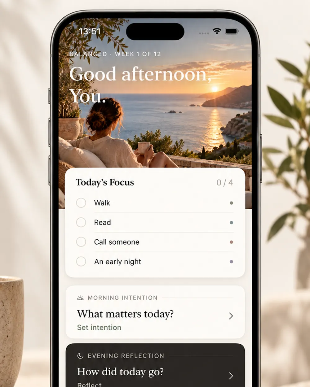 Aligned on iPhone: the Today screen with a daily focus list, morning intention and evening reflection