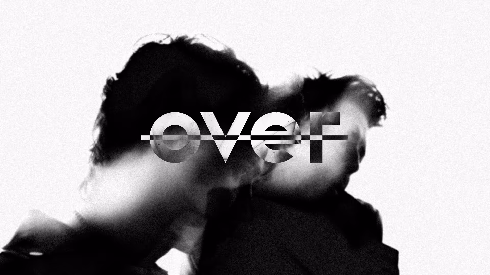 Black and white abstract image of two blurred faces close together with the word 'over' partially transparent across the center.