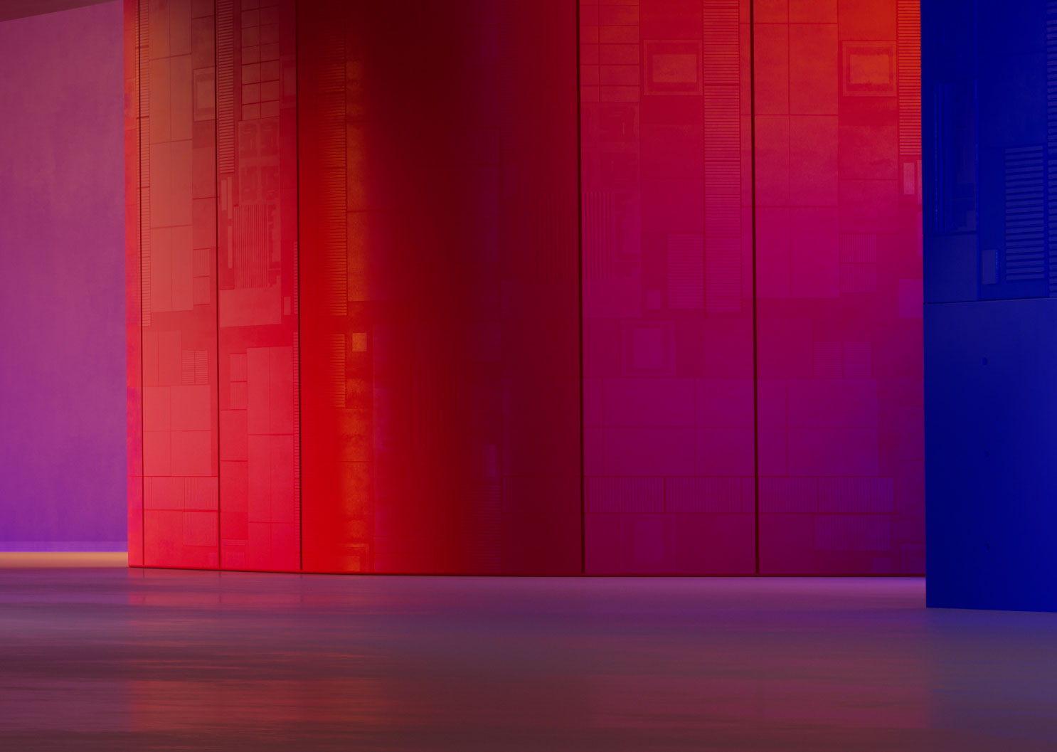 The Snapdragon Summit event stage in Maui, Hawaii is lit in shades of red, blue and purple.
