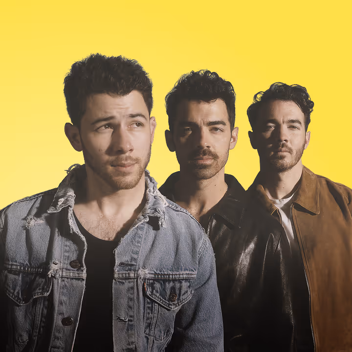A portrait of The Jonas Brothers' Nick, Joe, and Kevin appear against a yellow gradient background.