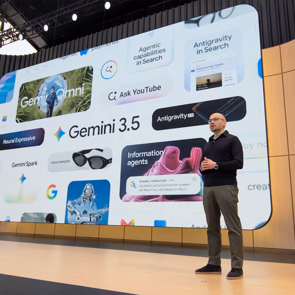 Demis Hassabis on stage at Google I/O, standing before a screen with a bento graphic displaying “Gemini 3.5.”