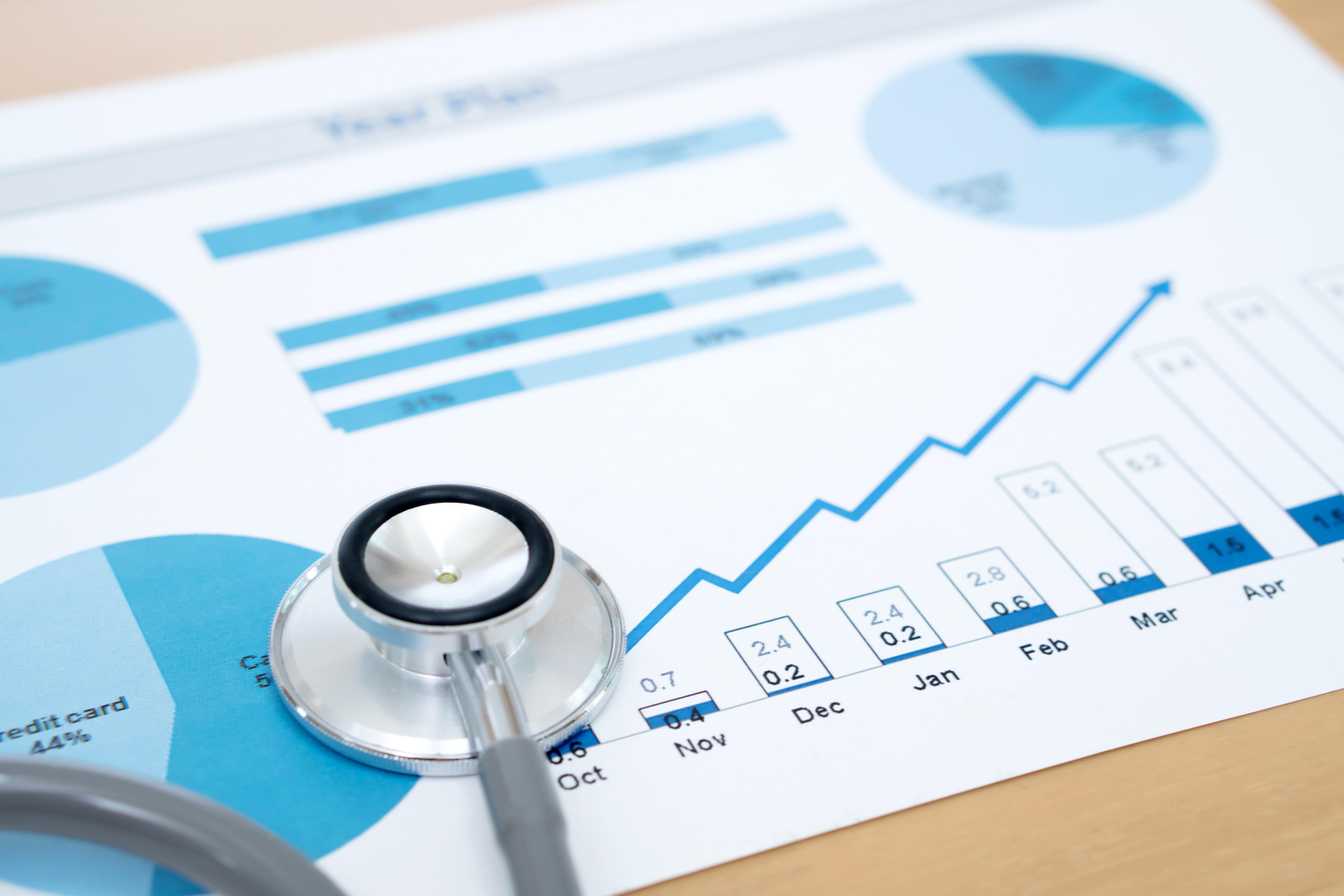 Charts with a stethoscope on it 