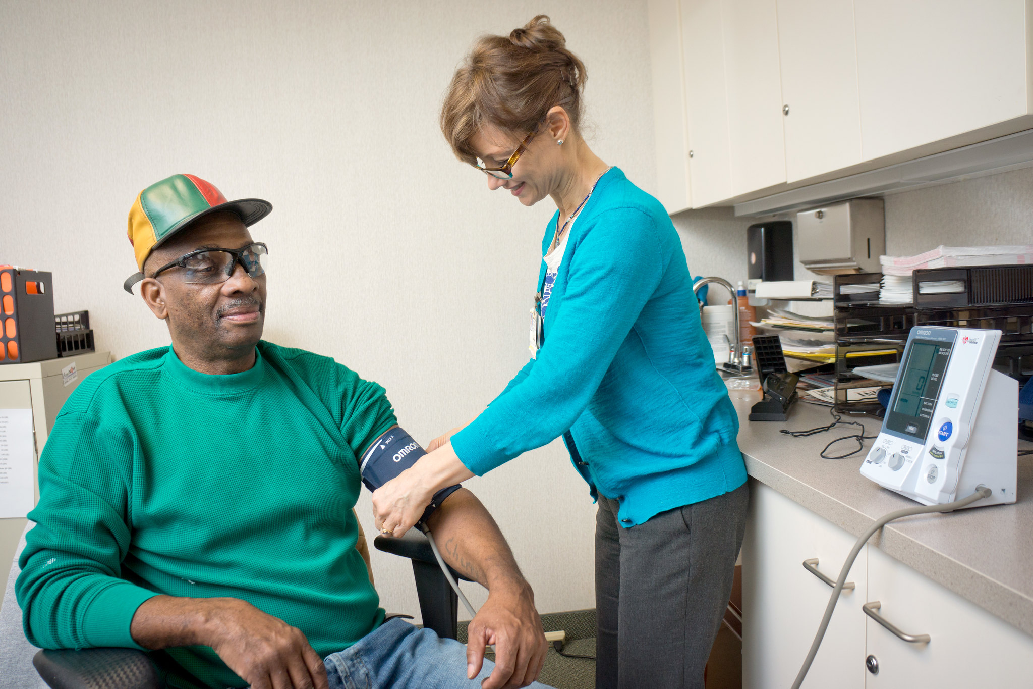 Male patient having his blood pressure measured