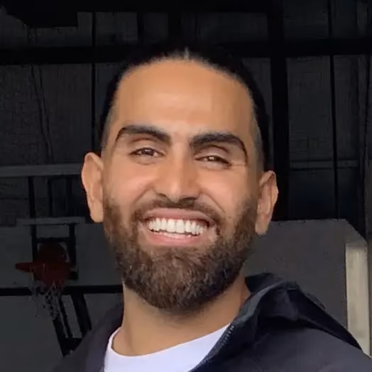 Guy Smiling wearing a hoodie