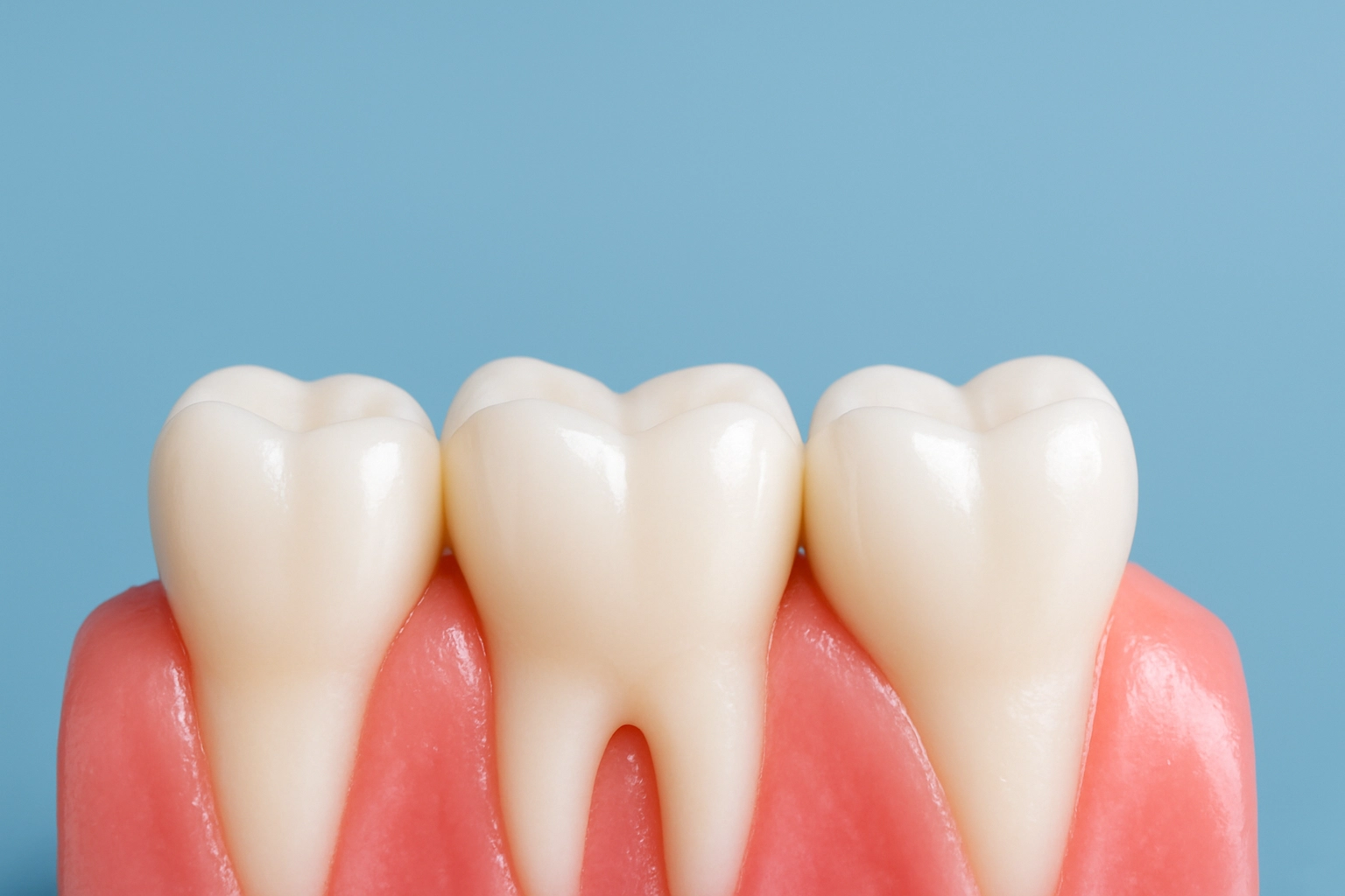 photo realistic image of healthy teeth and gums showing smooth pink gum tissue and white glossy molars on blue background