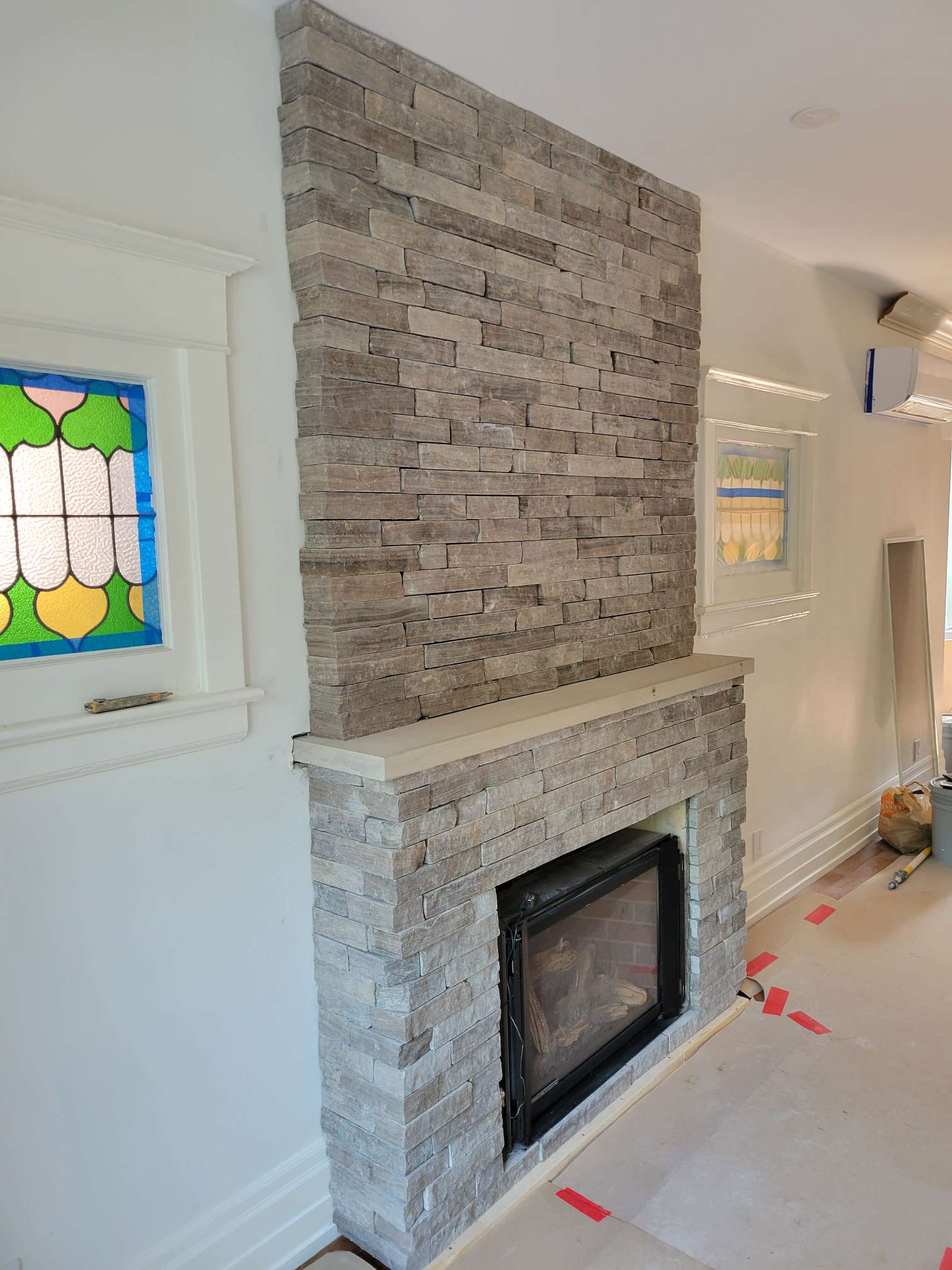 natural stone veneer installation on fireplace
