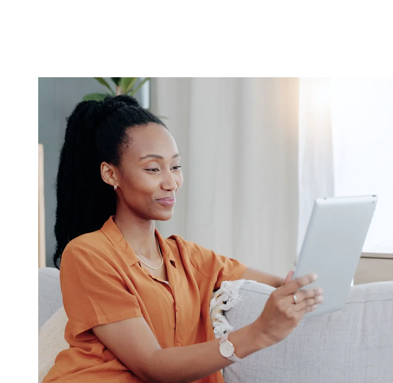 happy woman holding tablet