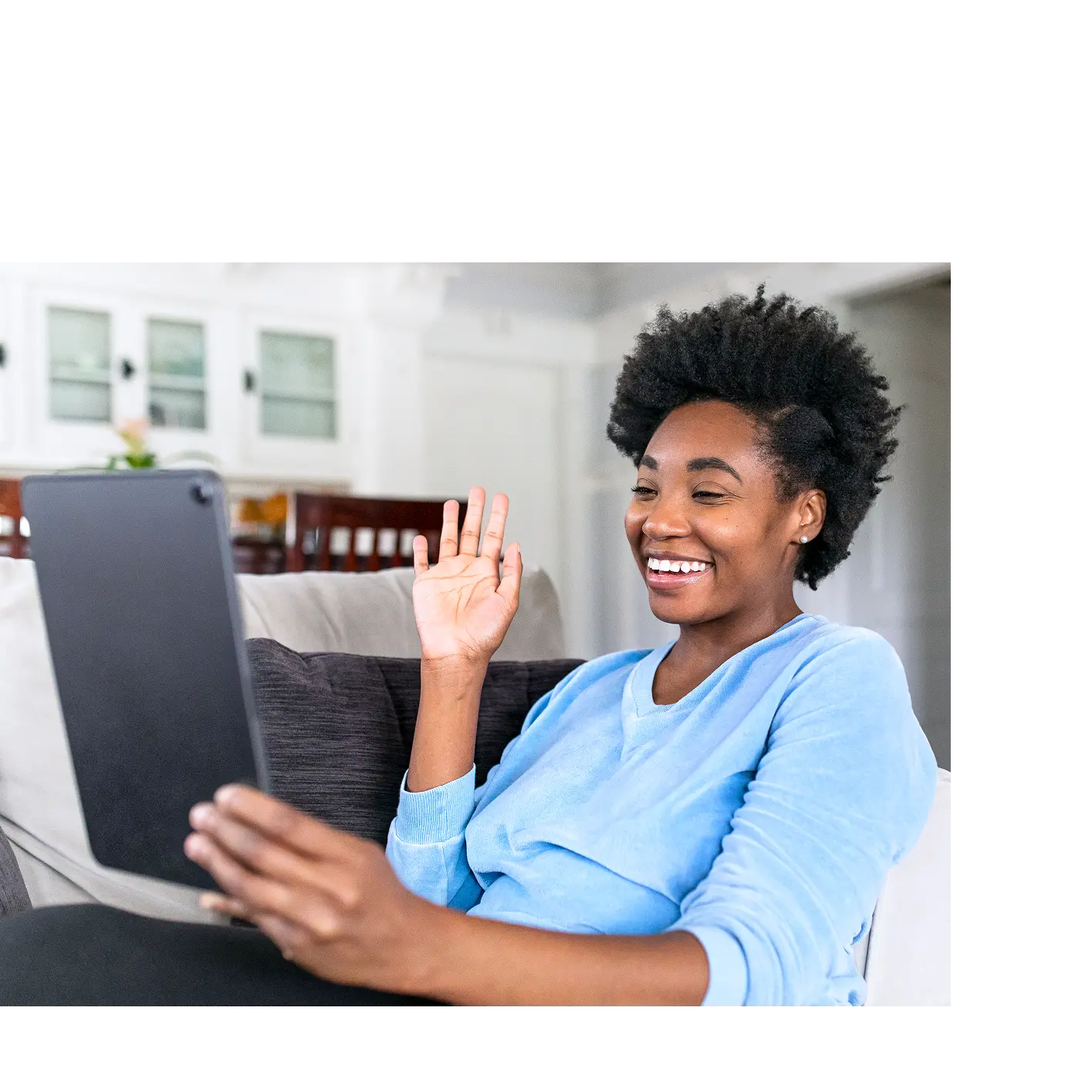 Woman holding tablet smiling