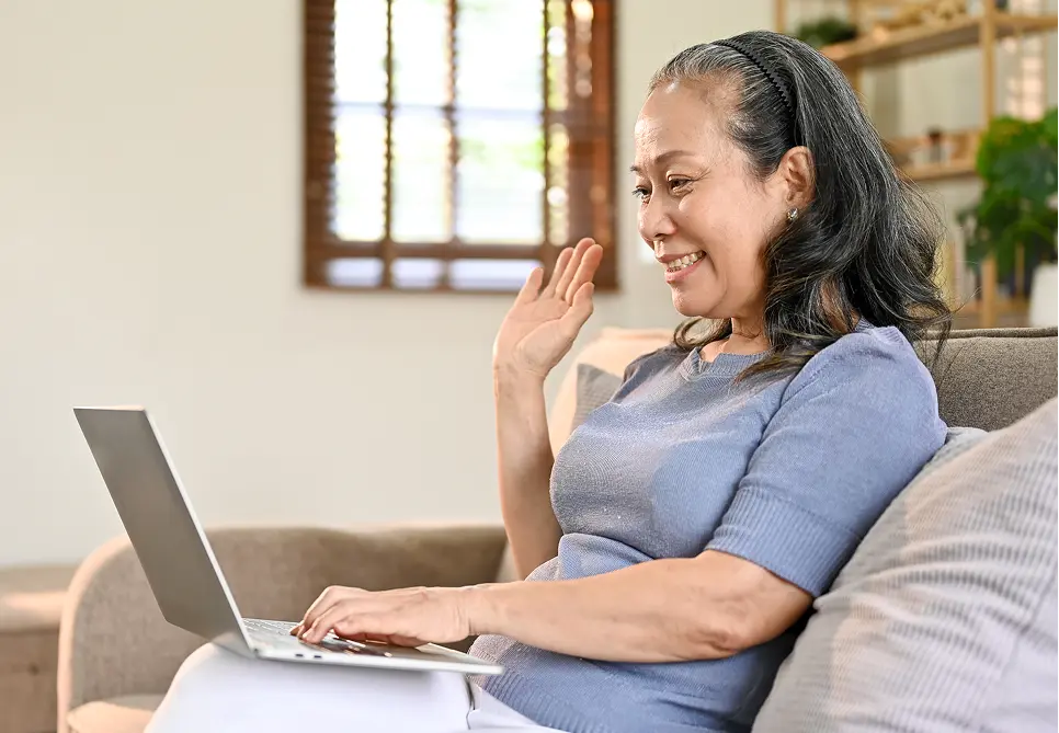 woman saying hi on laptop screen