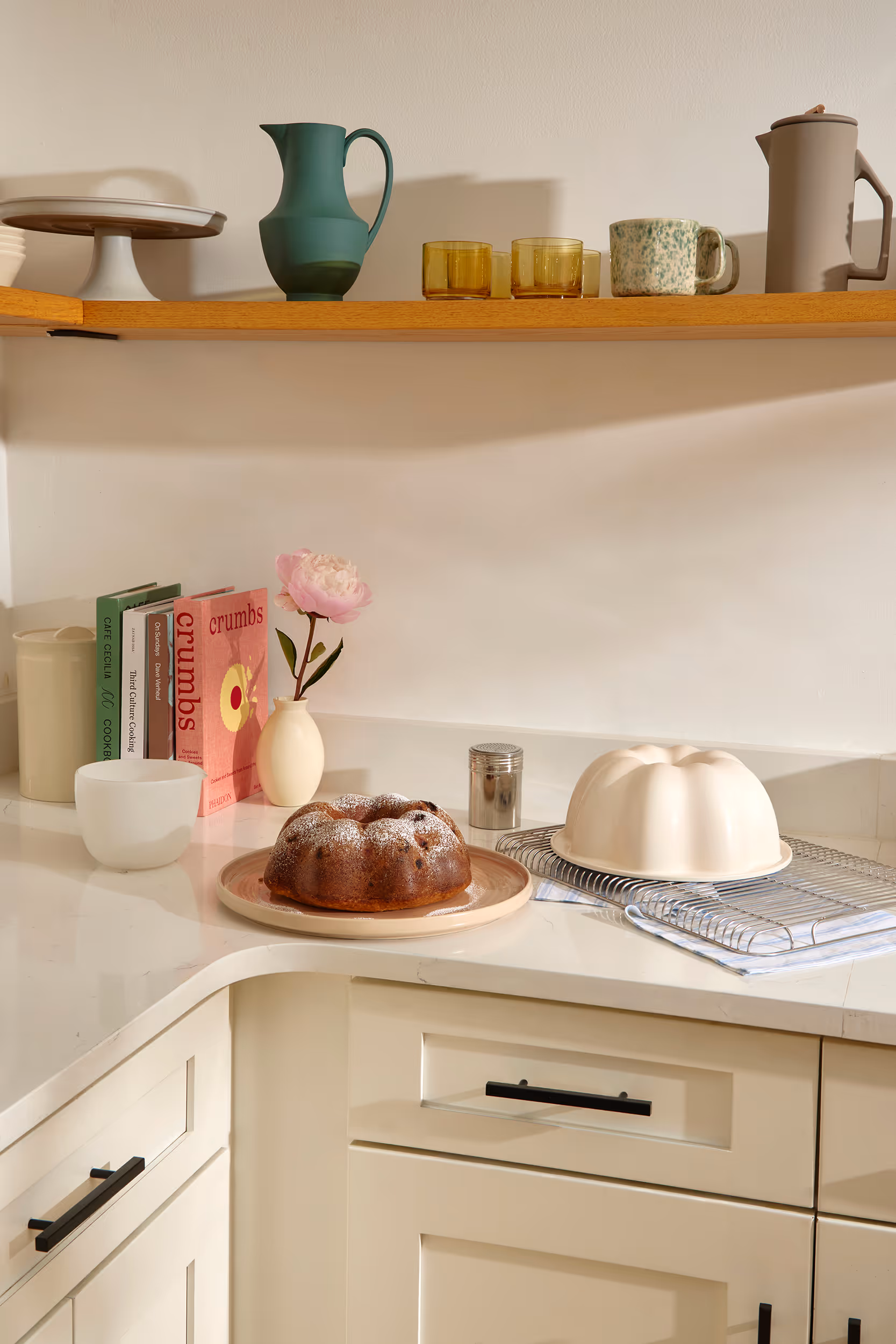 Caraway Bakeware+ Fluted Cake Pan on a kitchen counter.