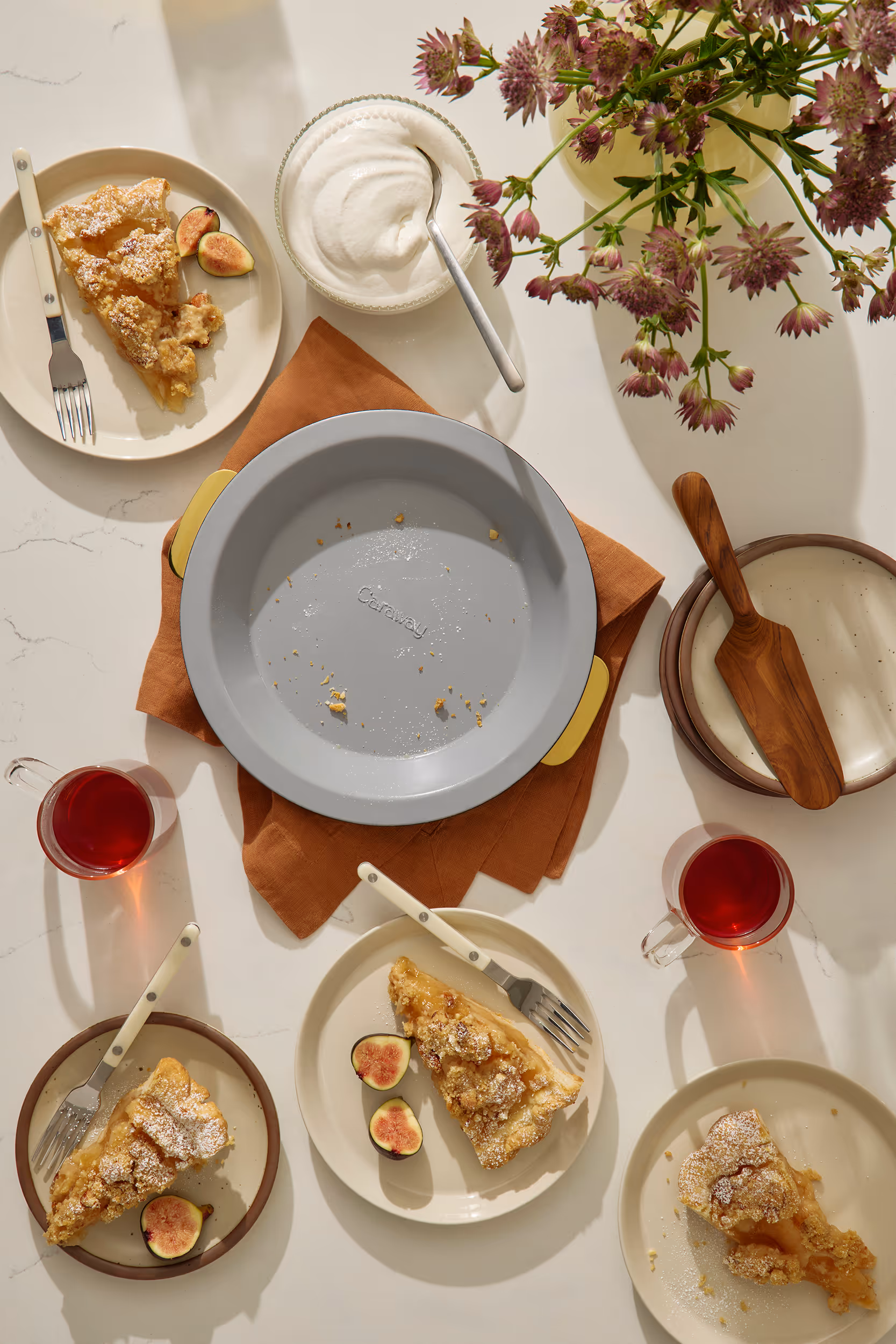 Caraway Bakeware+ Pie Pan on a kitchen counter.