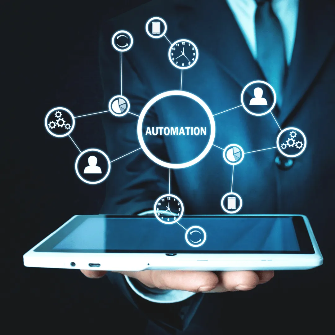 A person in a suit holding a tablet with lots of online and smart icons radiating from it