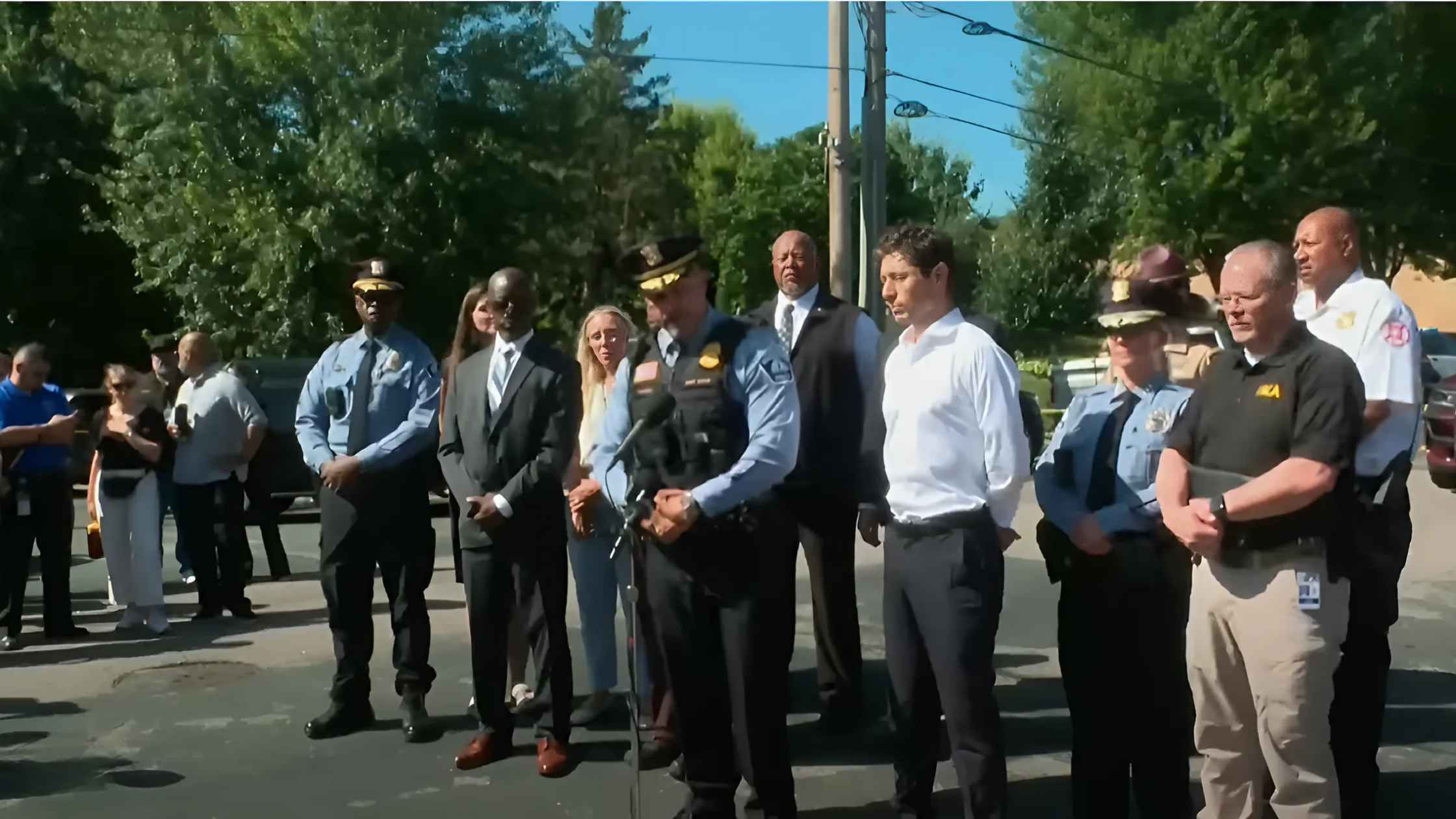 Officials speak to press. 