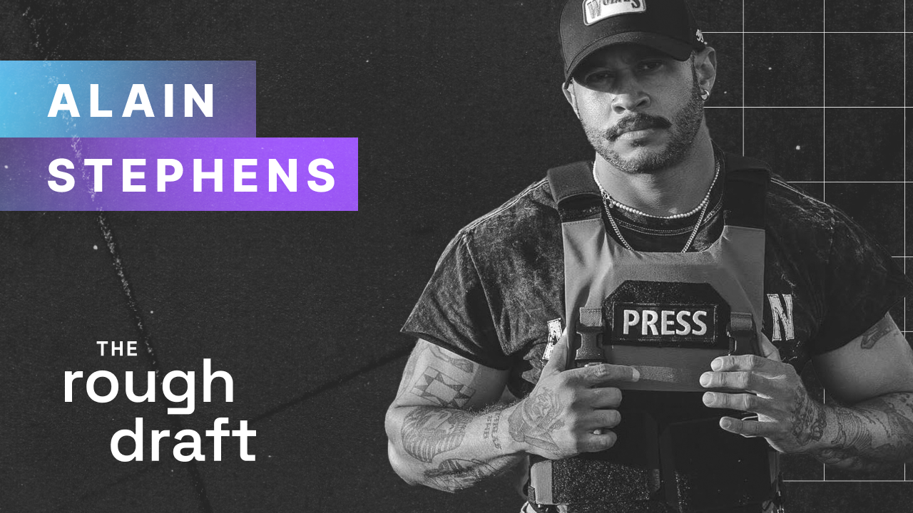 Alain Stephens professional headshot showing person in dark suit smiling against neutral backdrop