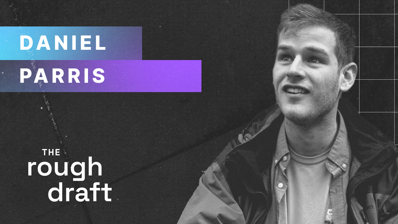 Host Daniel Parris speaking into microphone for rev podcast cover art in studio