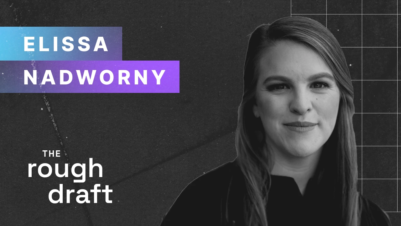 Elissa Nadworny, journalist, headshot smiling at camera wearing navy blazer on gray background