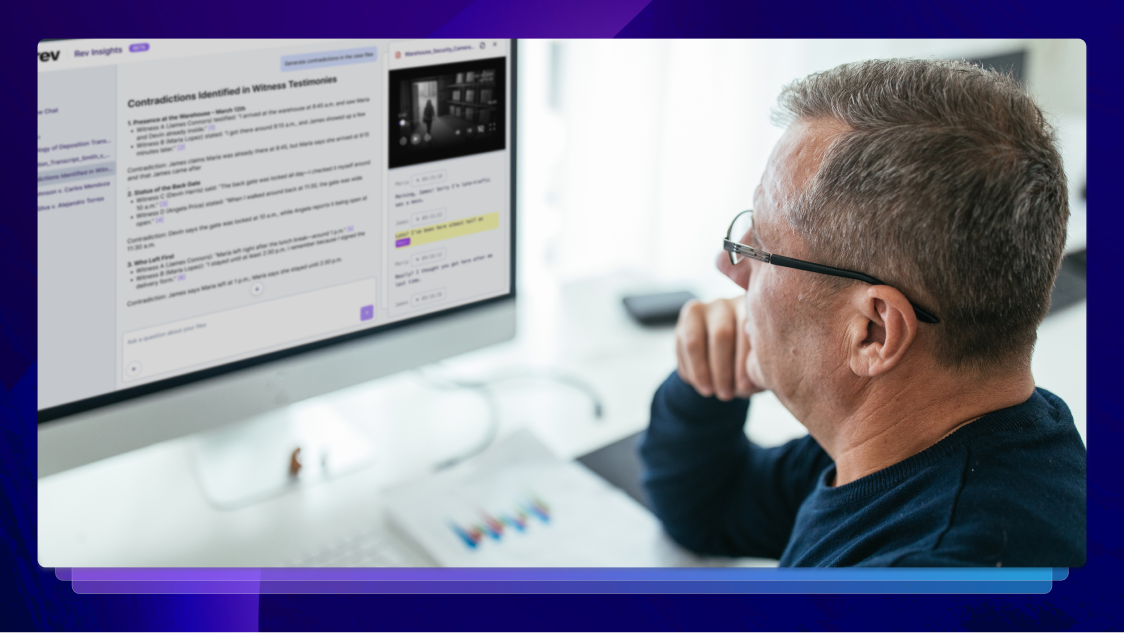 Man wearing glasses sitting at a desk and evidence analysis on a computer screen using Rev’s advanced tools to uncover key insights.