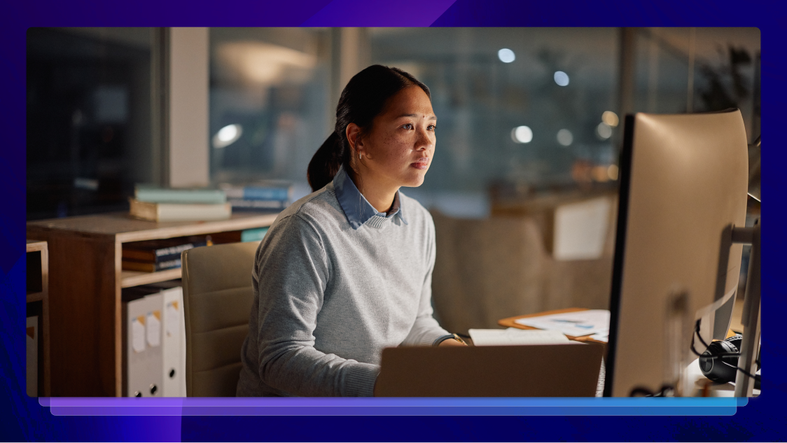 professional working attentively at her computer, reflecting a strong commitment to data privacy and security.
