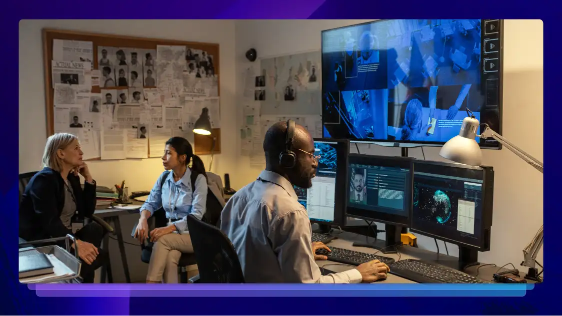 A person sitting in front of a computer conducting digital evidence management.