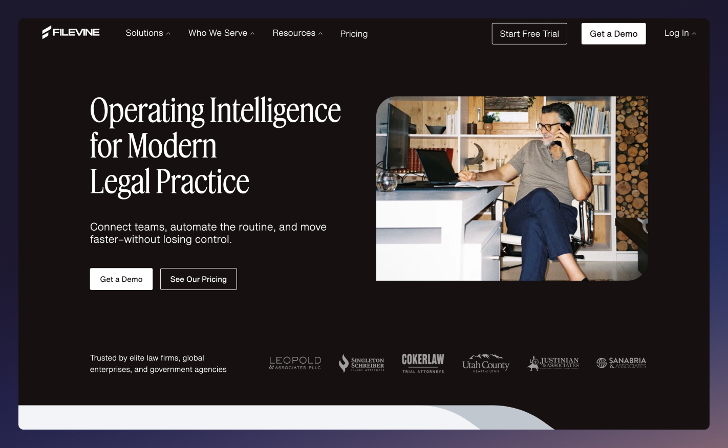 The homepage of the Filevine website with a gradient purple border around it.