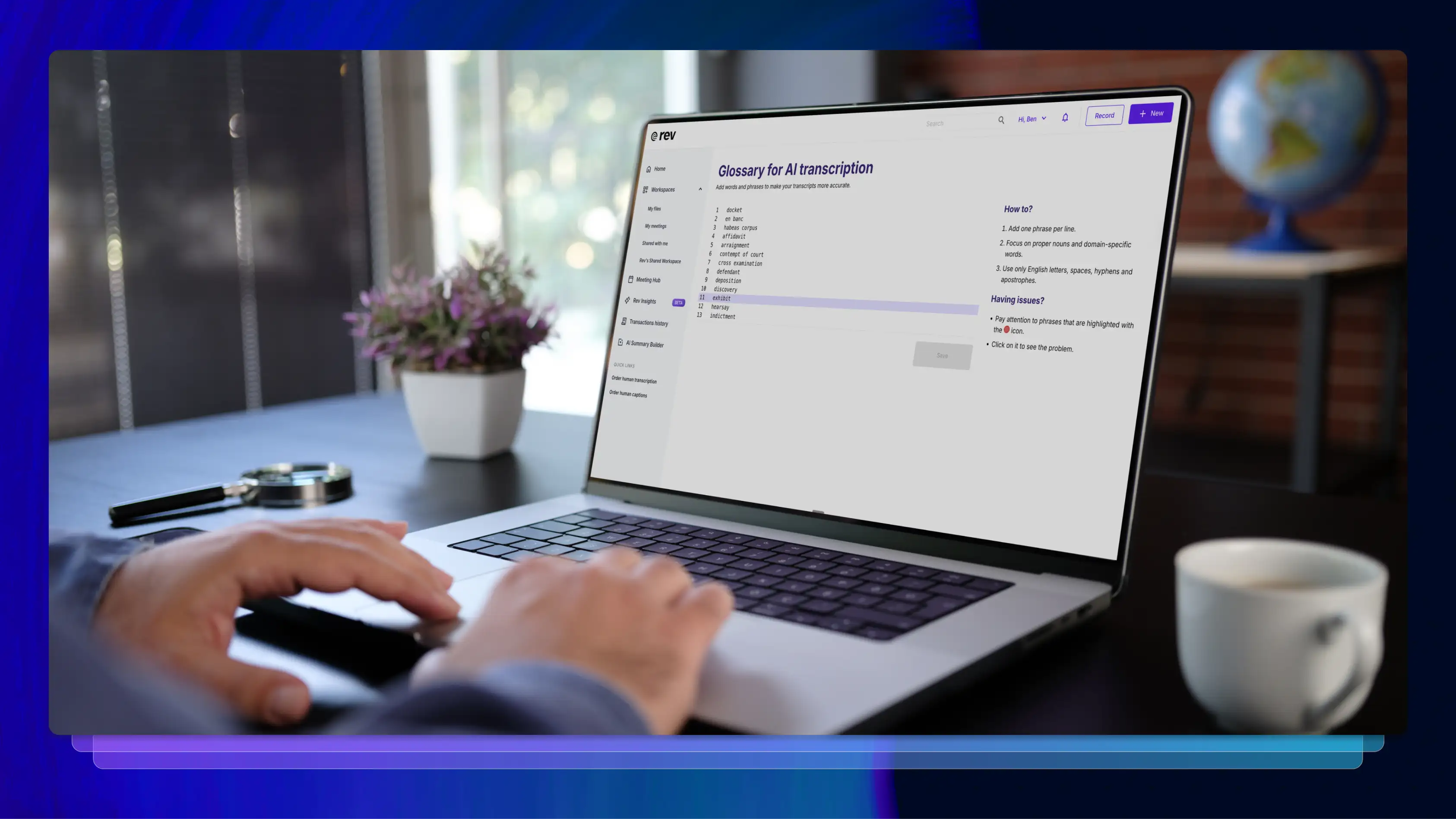 Man’s hands on a laptop keyboard with Rev’s Glossary for AI transcription on the screen.