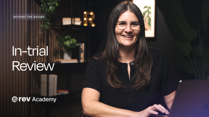 A woman in a black shirt and glasses smiles at the camera. Text reads "Beyond the Basics, In-trial Review, Rev Academy."