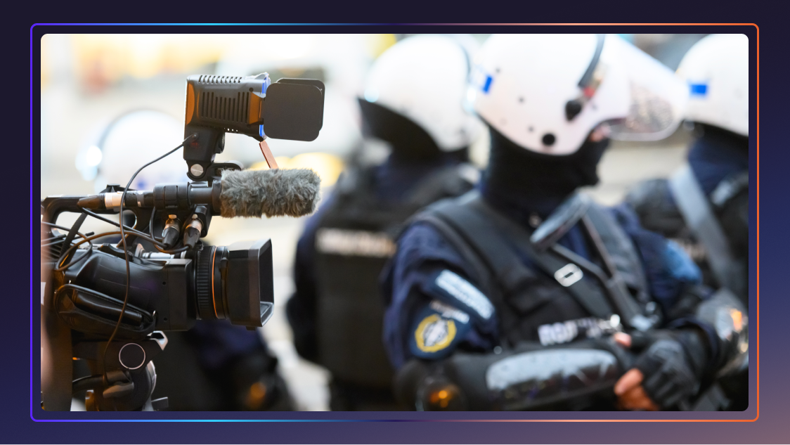 A camera recording police officers to document the police shortage crisis.