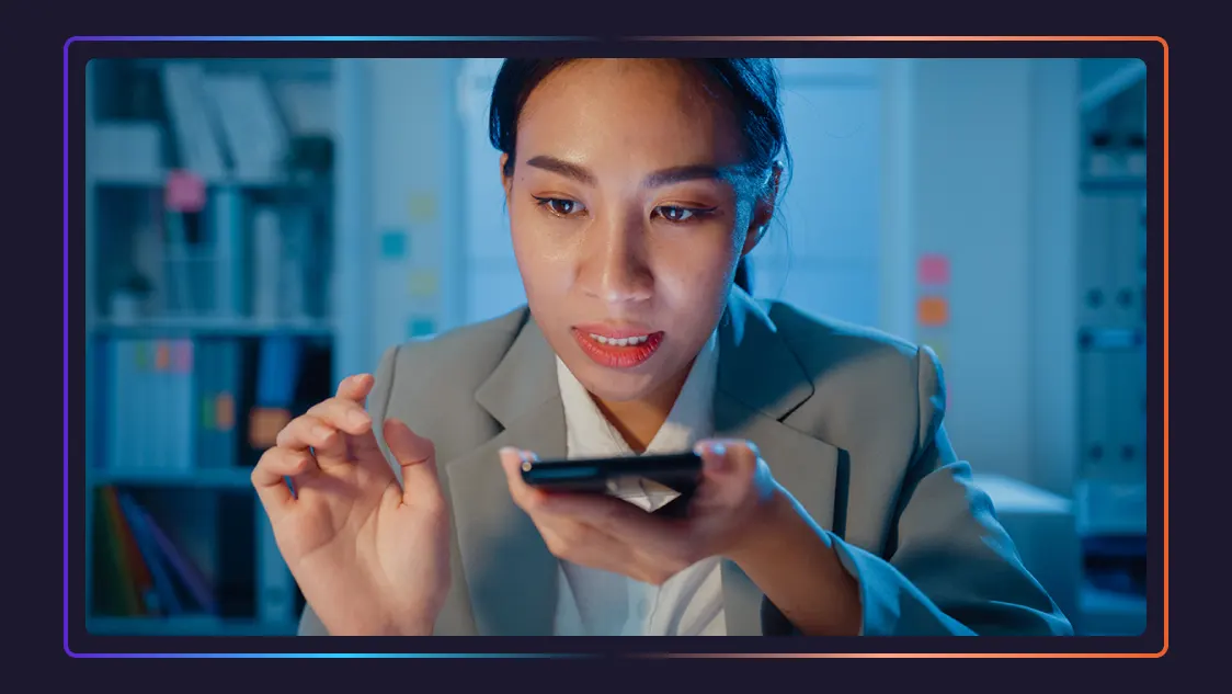 A lawyer dictates notes using her phone.
