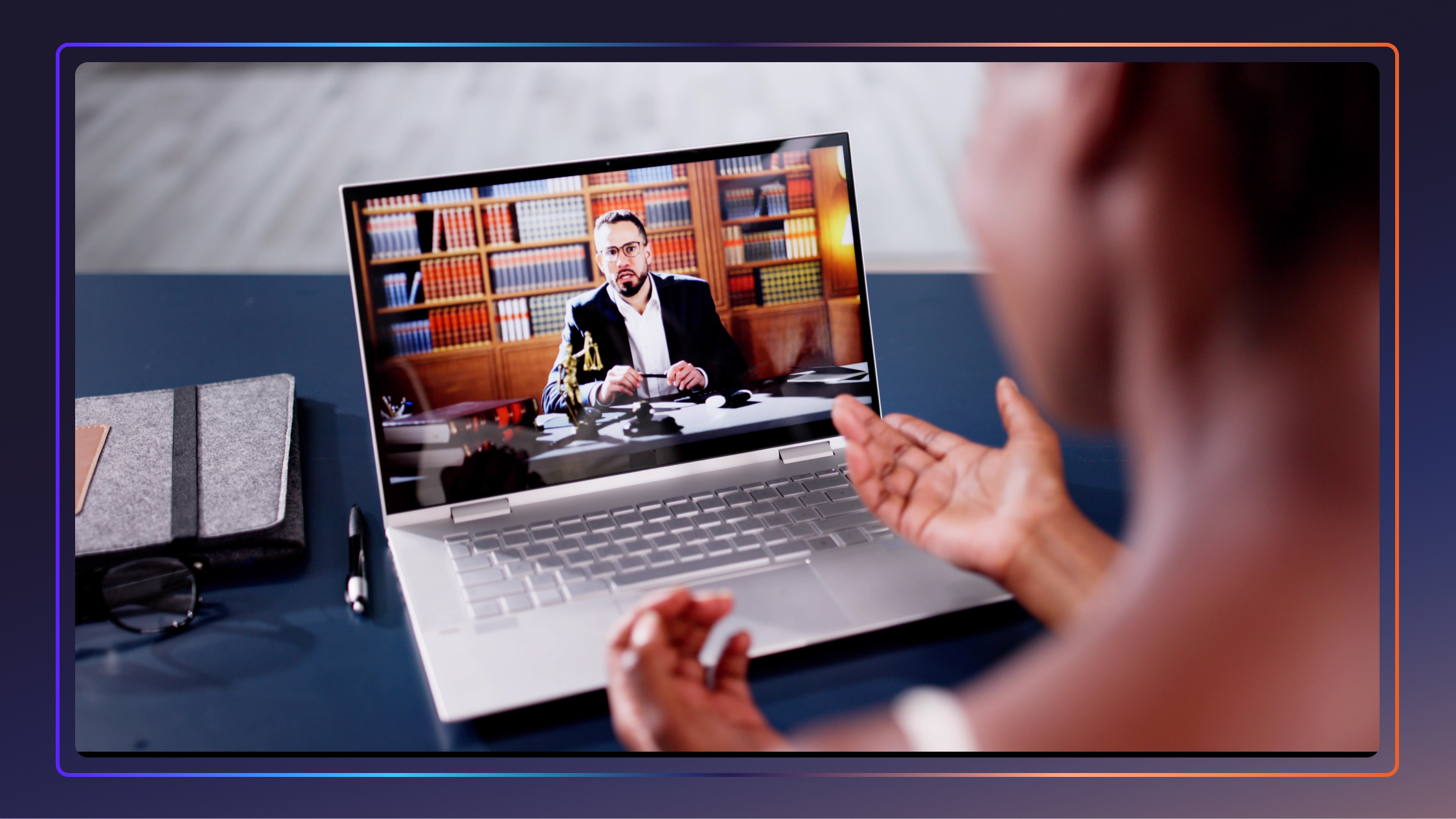 A client with splayed hands meeting with an attorney in digital court via a laptop.