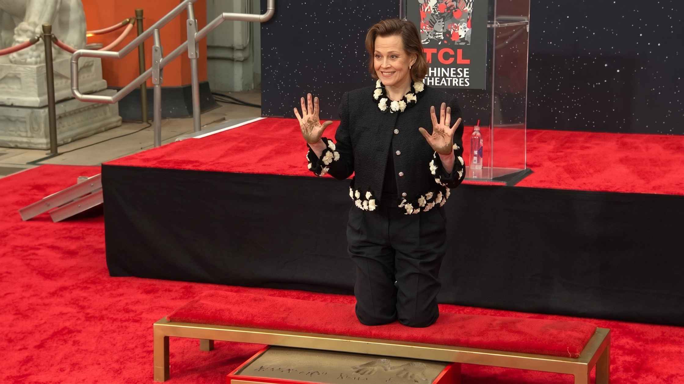 Sigourney Weaver is immortalized with a handprint ceremony.