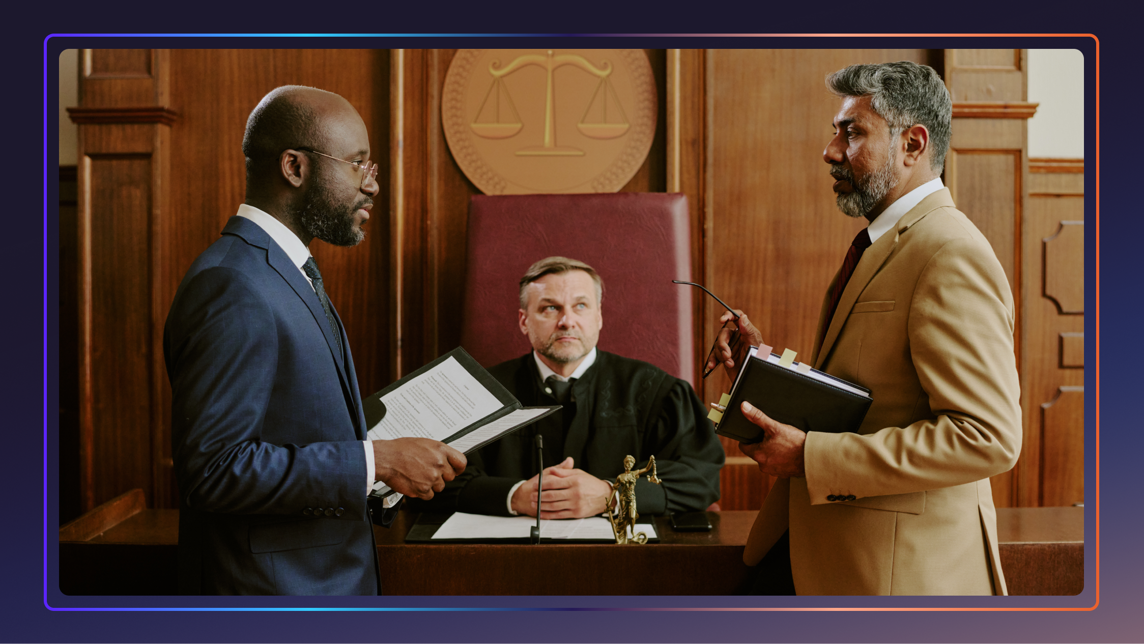 Two lawyers stand and face each other in a courtroom. A judge sits behind them.