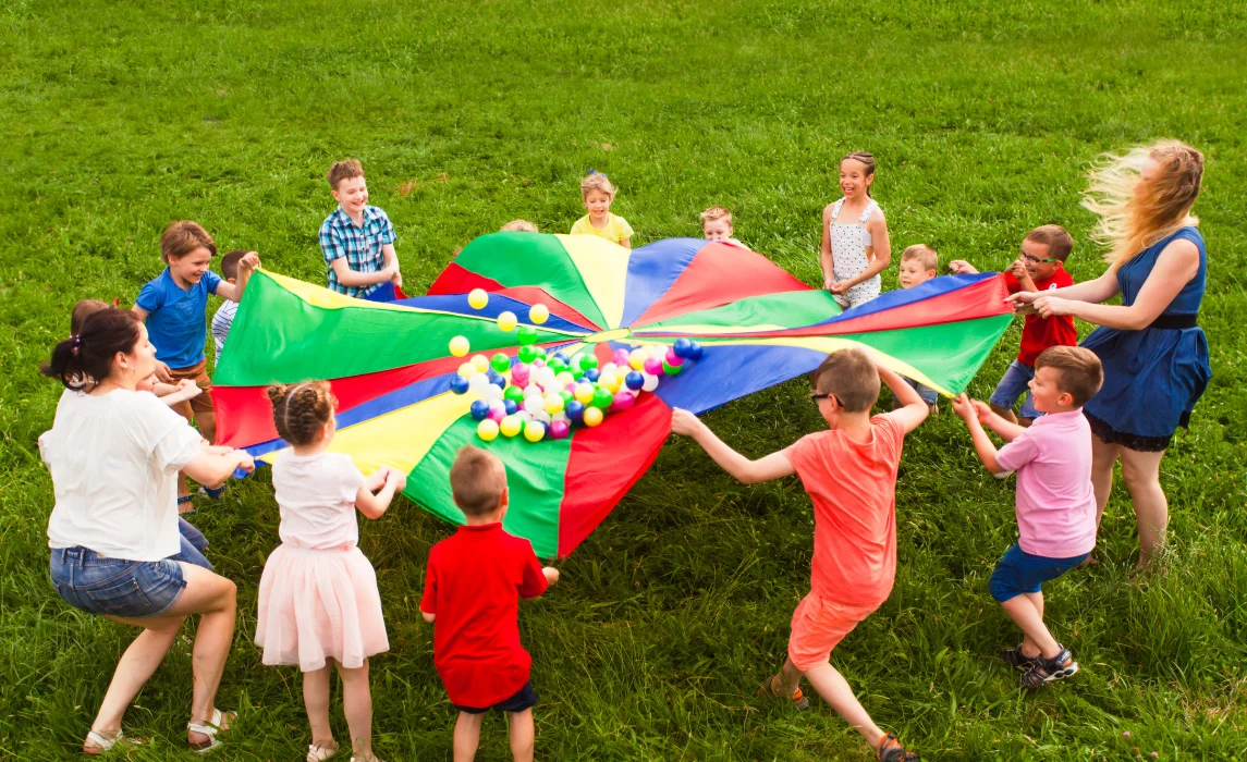 Kids putting balls in the middle