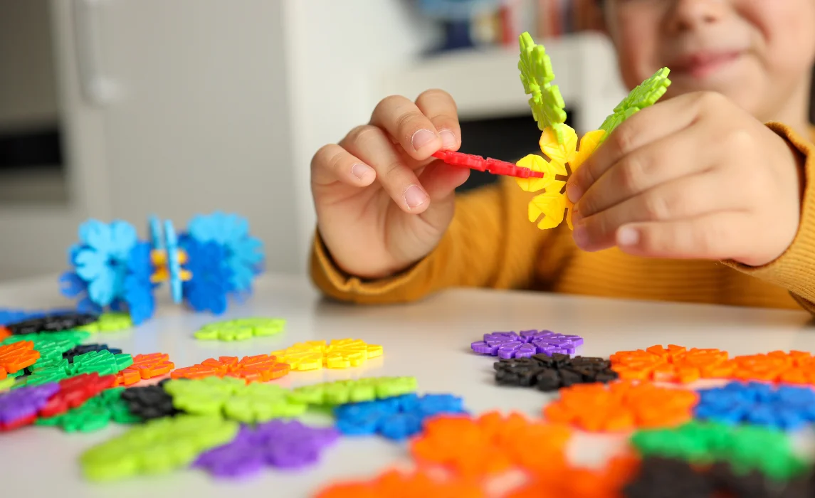 kid playing with flower puzzle