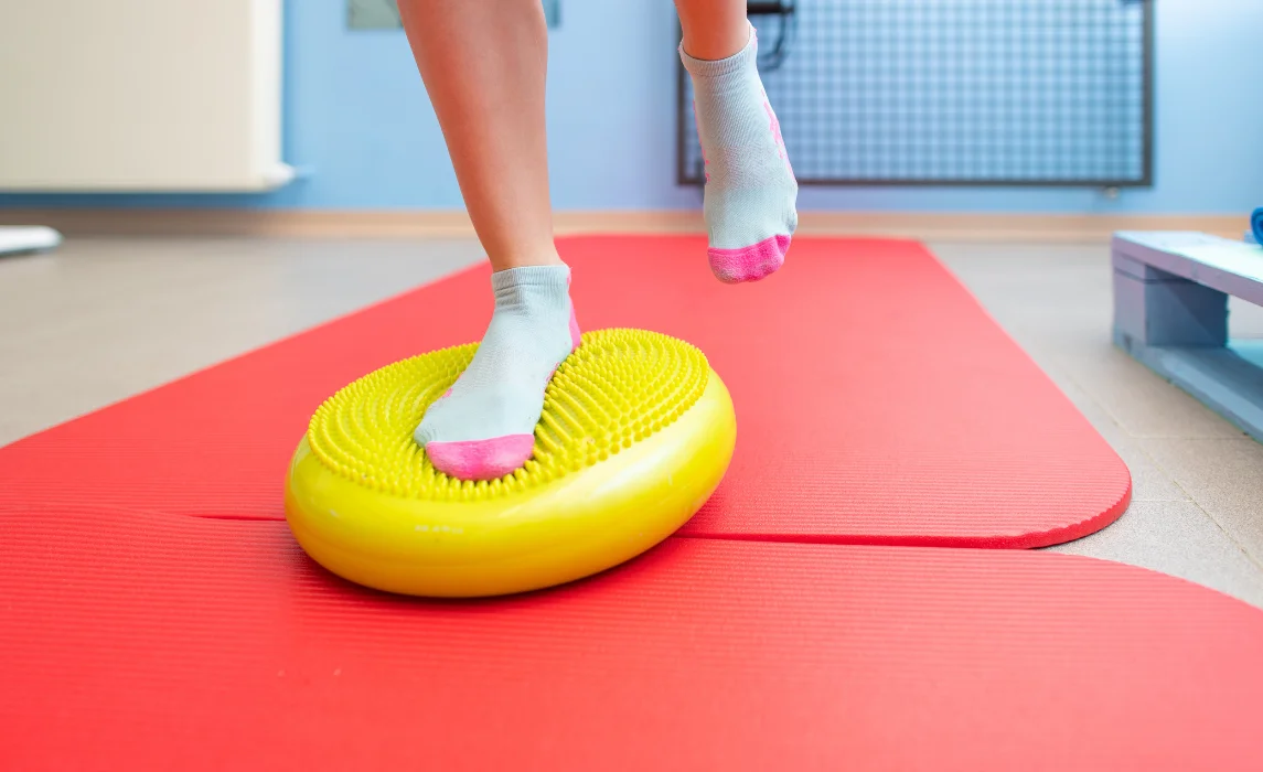 kid standing on a rubbered foam