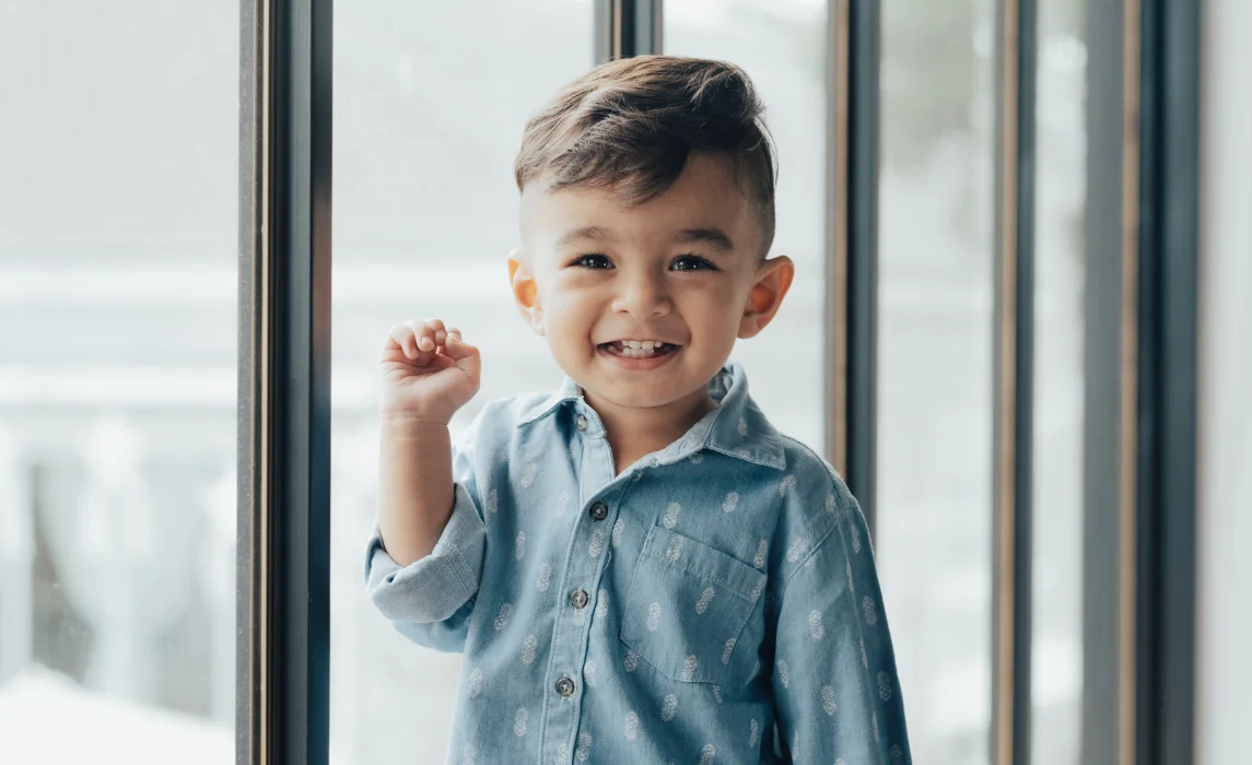 kid beside the the window