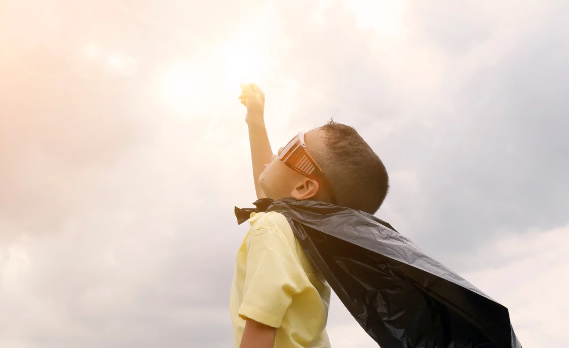 kid reaching to the sunlight